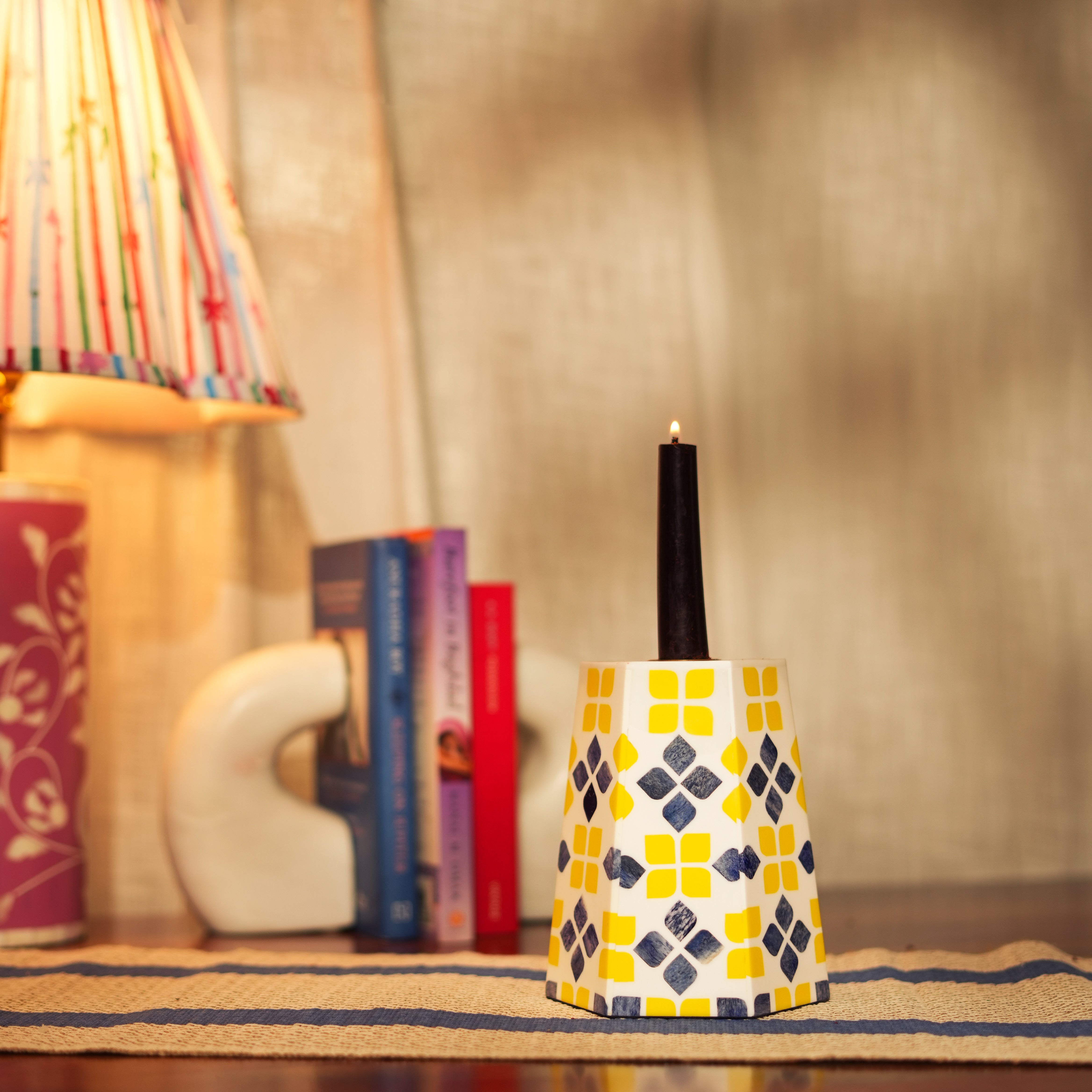 Taper candlestick holder with intricate yellow and grey bone inlay mosaic in a modern tapered silhouette.