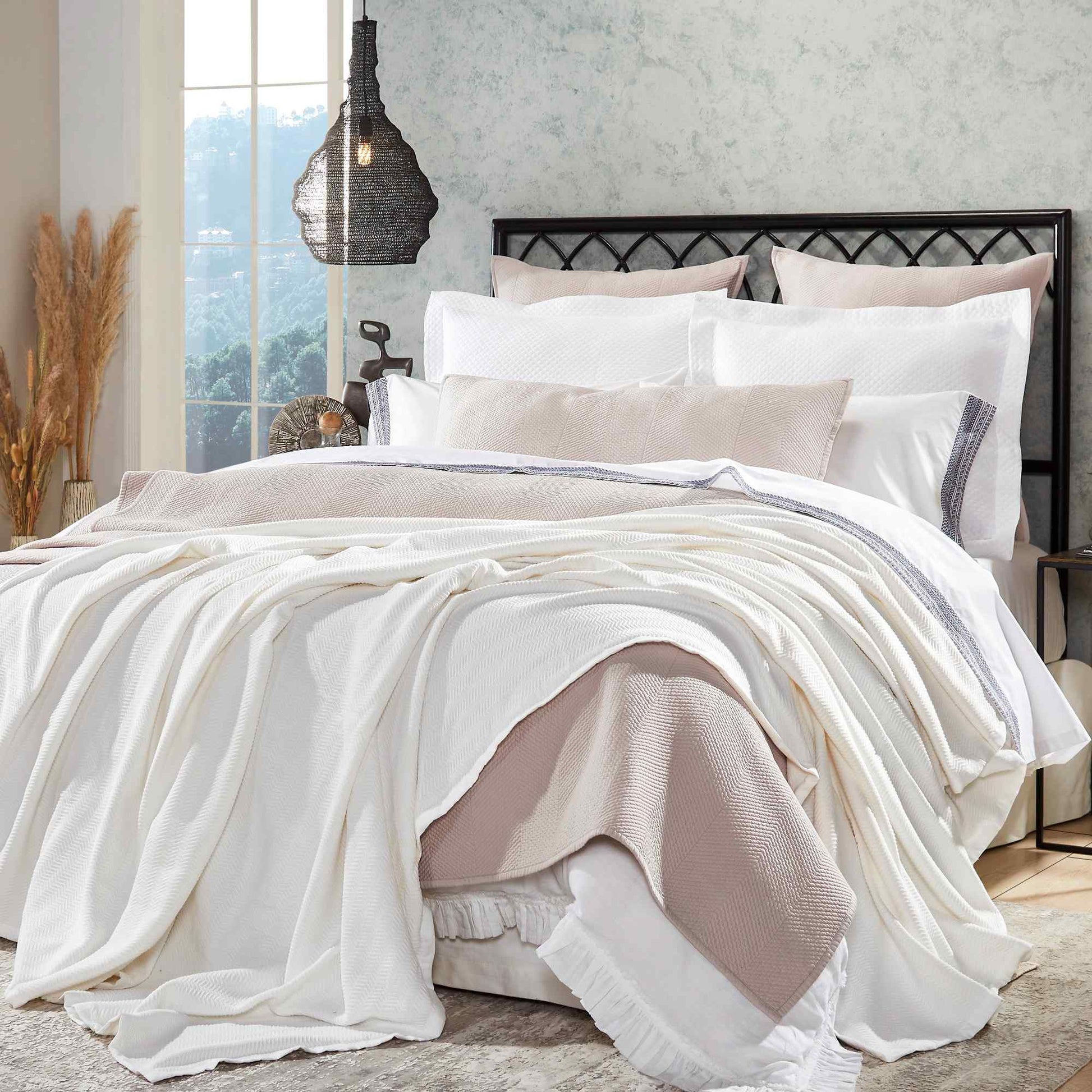 BL-854-9496_1|Beautifully layered white herringbone blanket and light pink throw on a luxurious bed setting, enhancing bedroom style.