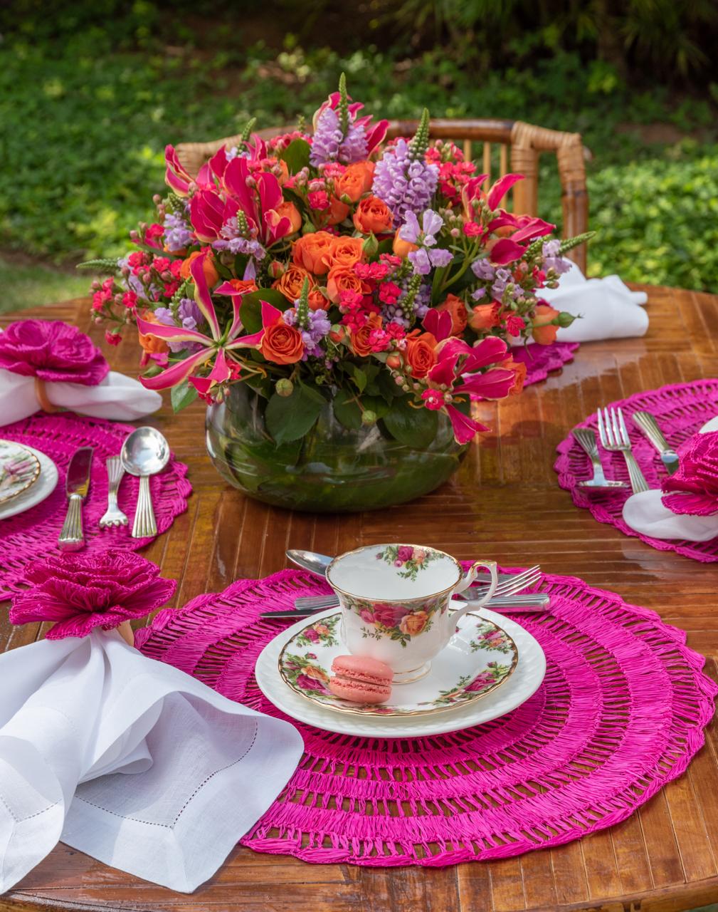 Buriti straw placemat handwoven from natural Brazilian palm fiber in pink by Talah Home