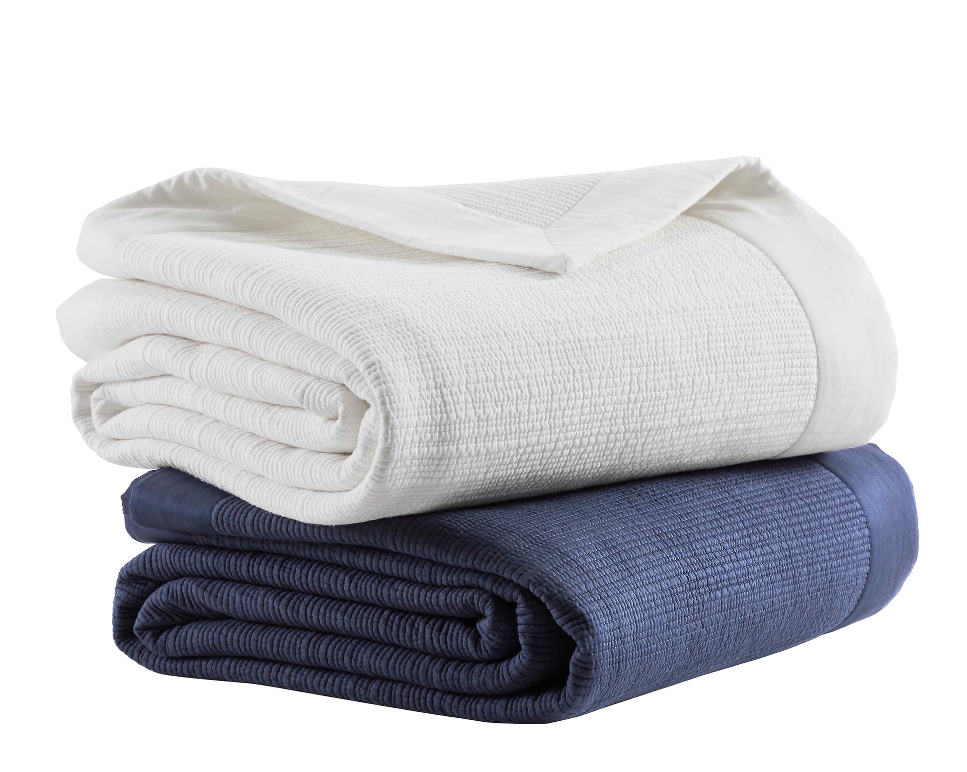 CL-158-DUP-X_2|Stacked white and navy blue textured coverlets, providing versatile, soft bedding layers for contemporary home design.