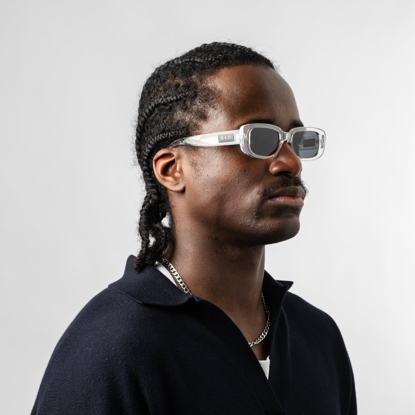 Male wearing Sad Eyewear Bouquet rectangle sunglasses clear frames with uv protection lenses