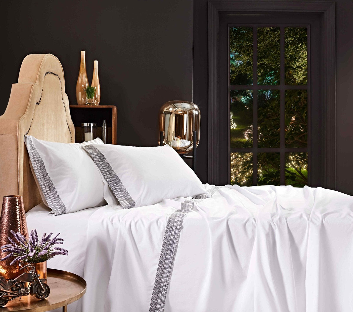 CSS-502-7284_4|Close-up of crisp white 100% cotton sheets and pillowcases with elegant woven grey trim, for a comfortable bed.
