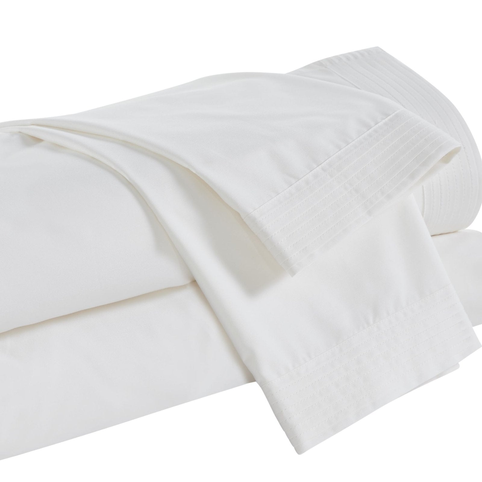 KSS-522-7880_5|Neatly folded cream 100% cotton sheets and pillowcases with elegant pleated hems, soft and inviting fabric.