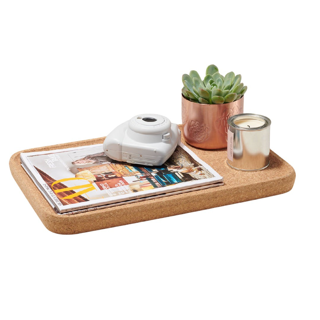a table with a vase of flowers and a potted plant 