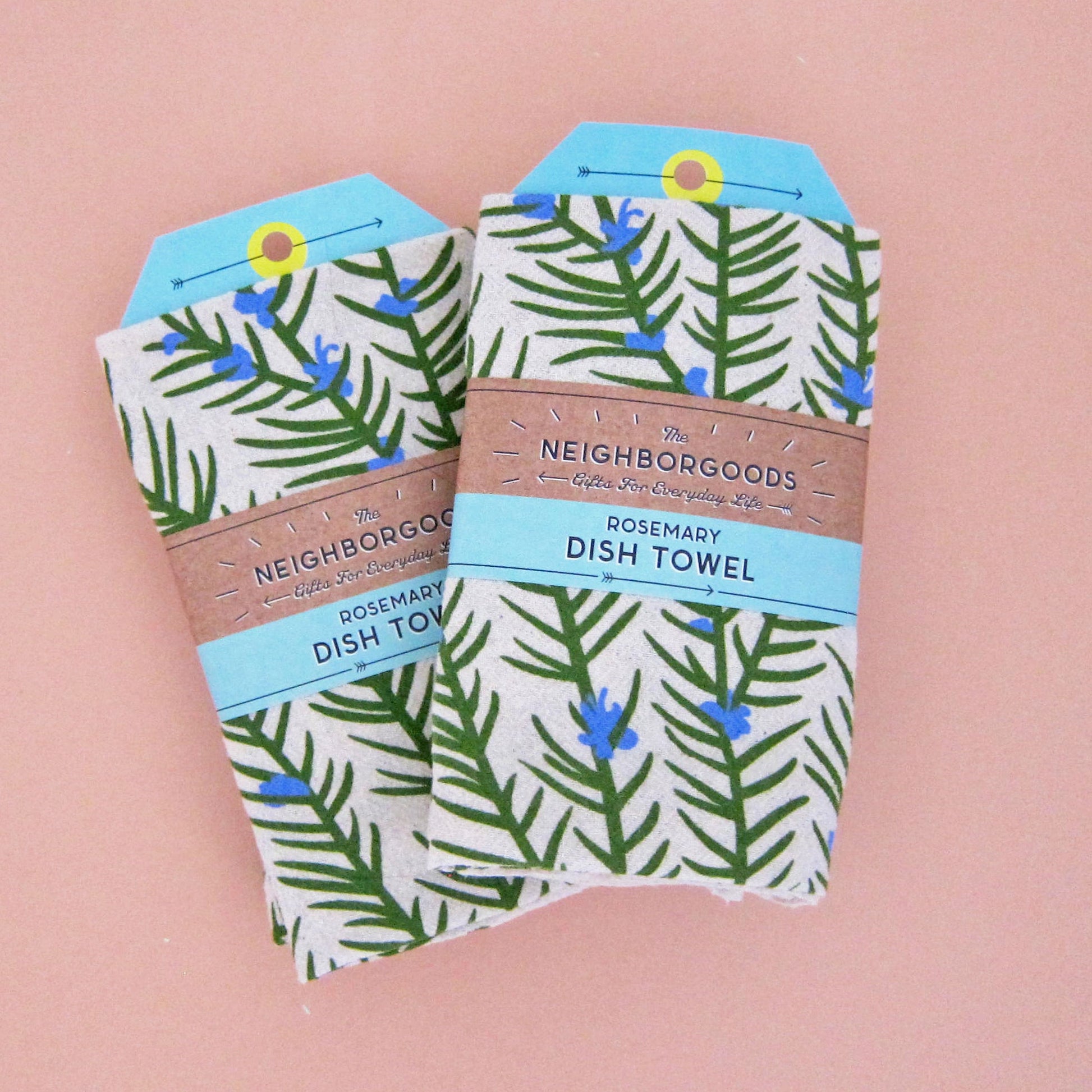 Two Rosemary dish towels individually packaged in branded belly band sleeves