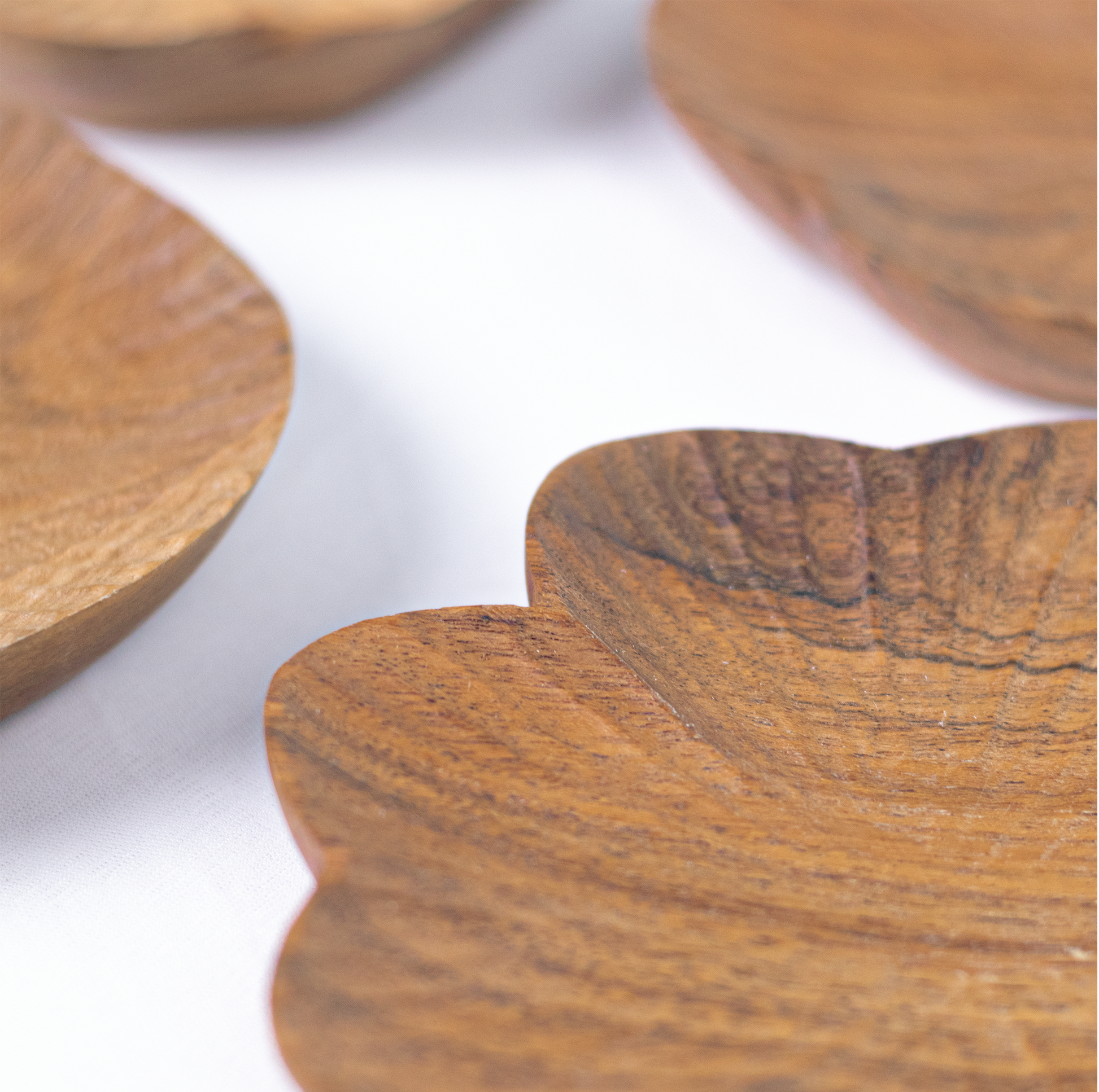 Close-up of hand-carved wood texture and natural grain on trinket tray