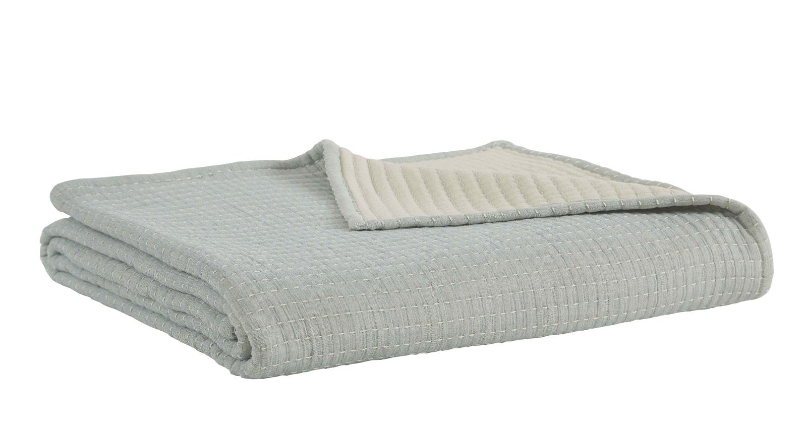 BT-106-9496_2|Light blue textured reversible quilt blanket, folded neatly, showcasing soft cream reverse for cozy bed and home decor.