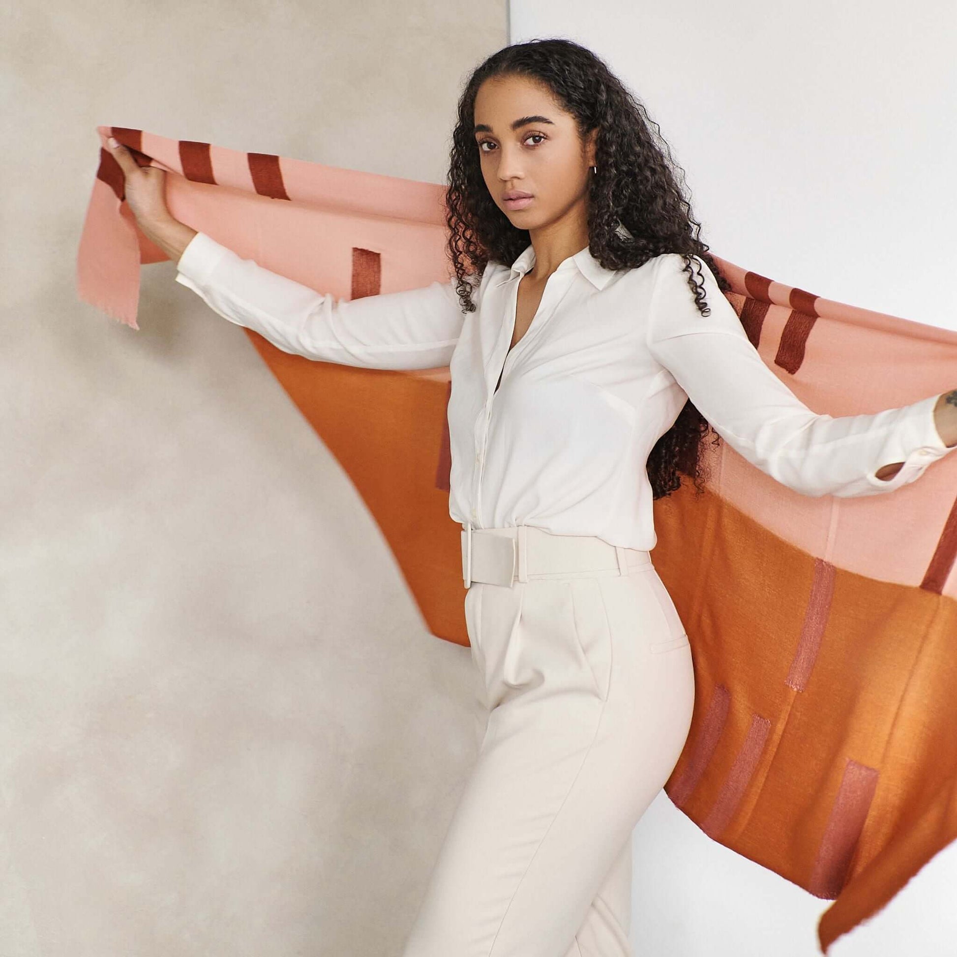 Canyon Hand Embroidered Hand Woven Merino Silk Soft Scarf draped elegantly over a model in a chic outfit.
