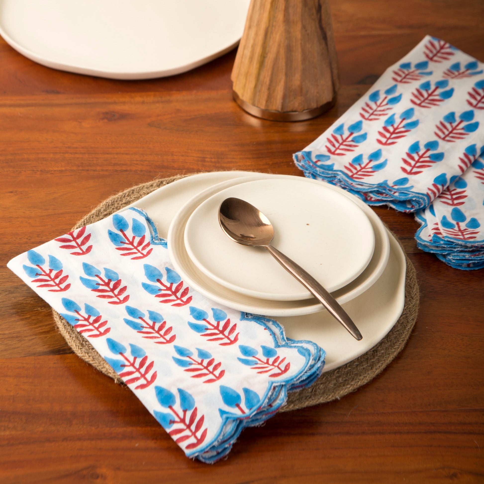 Napkins styled on dining table with tableware
