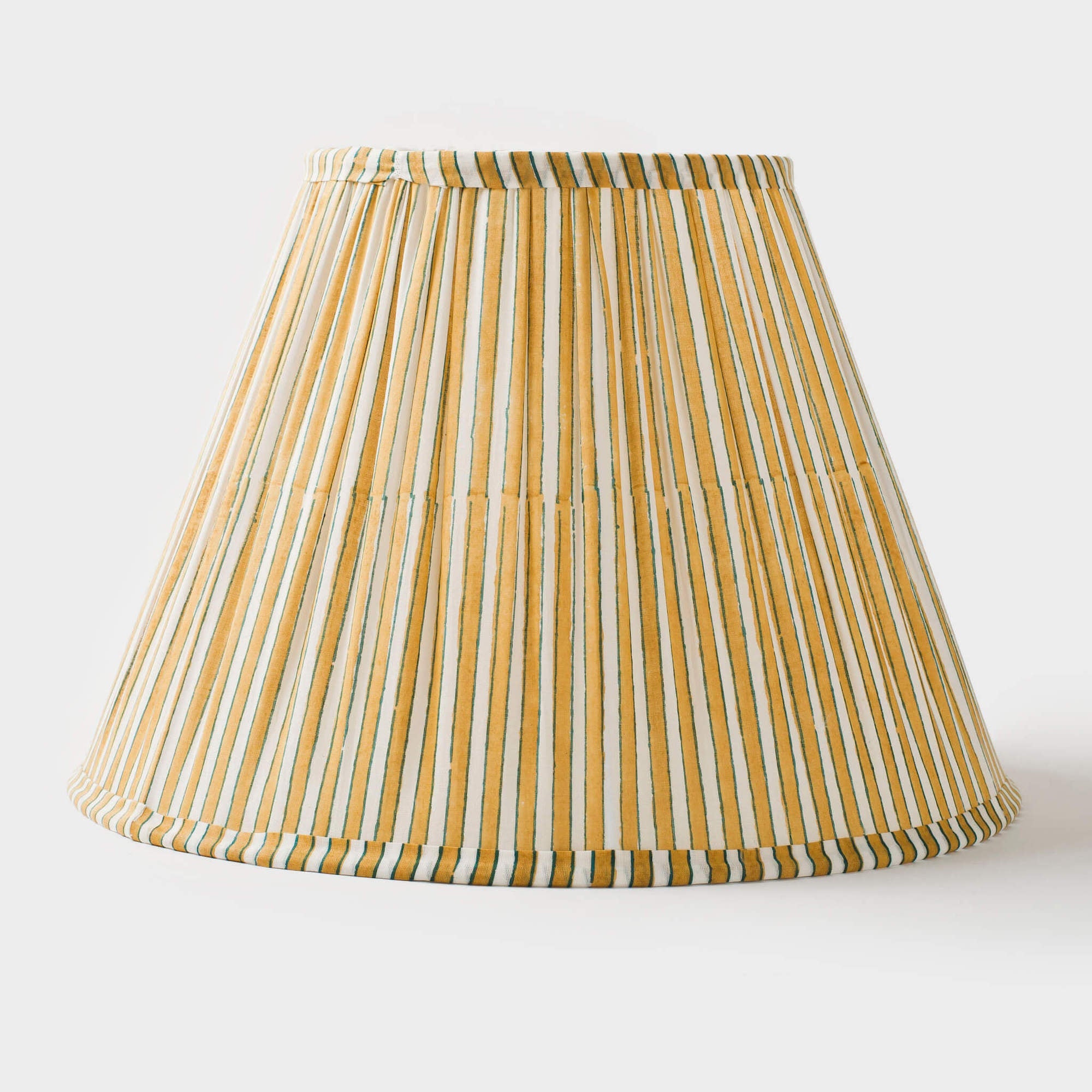 Yellow and white Candystripe pleated cotton lamp shade with a classic tapered silhouette.