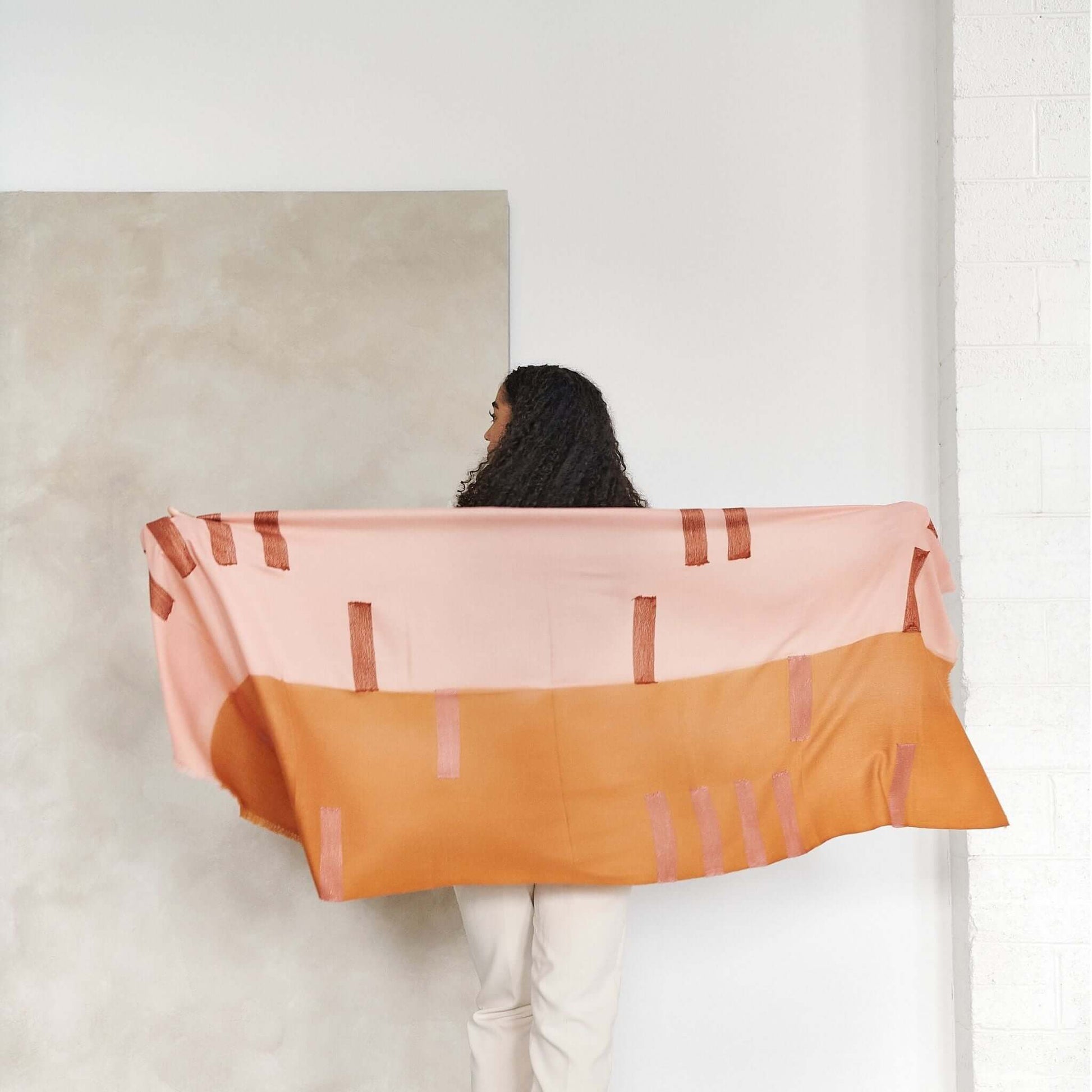 Canyon Hand Embroidered Hand Woven Merino Silk Soft Scarf in contemporary design, draped elegantly by a model.