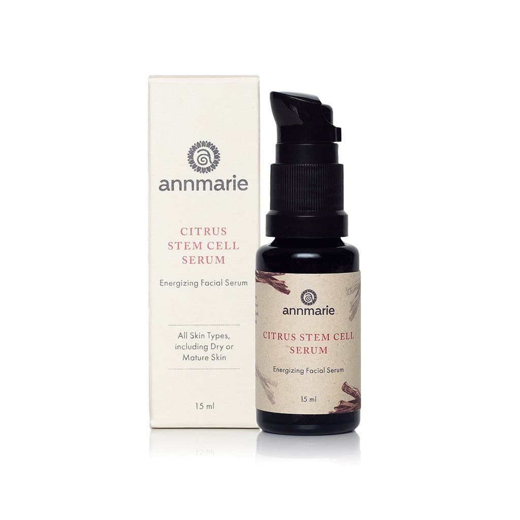 Citrus Stem Cell Serum energizing facial serum bottle with pump beside its product box on a white background.