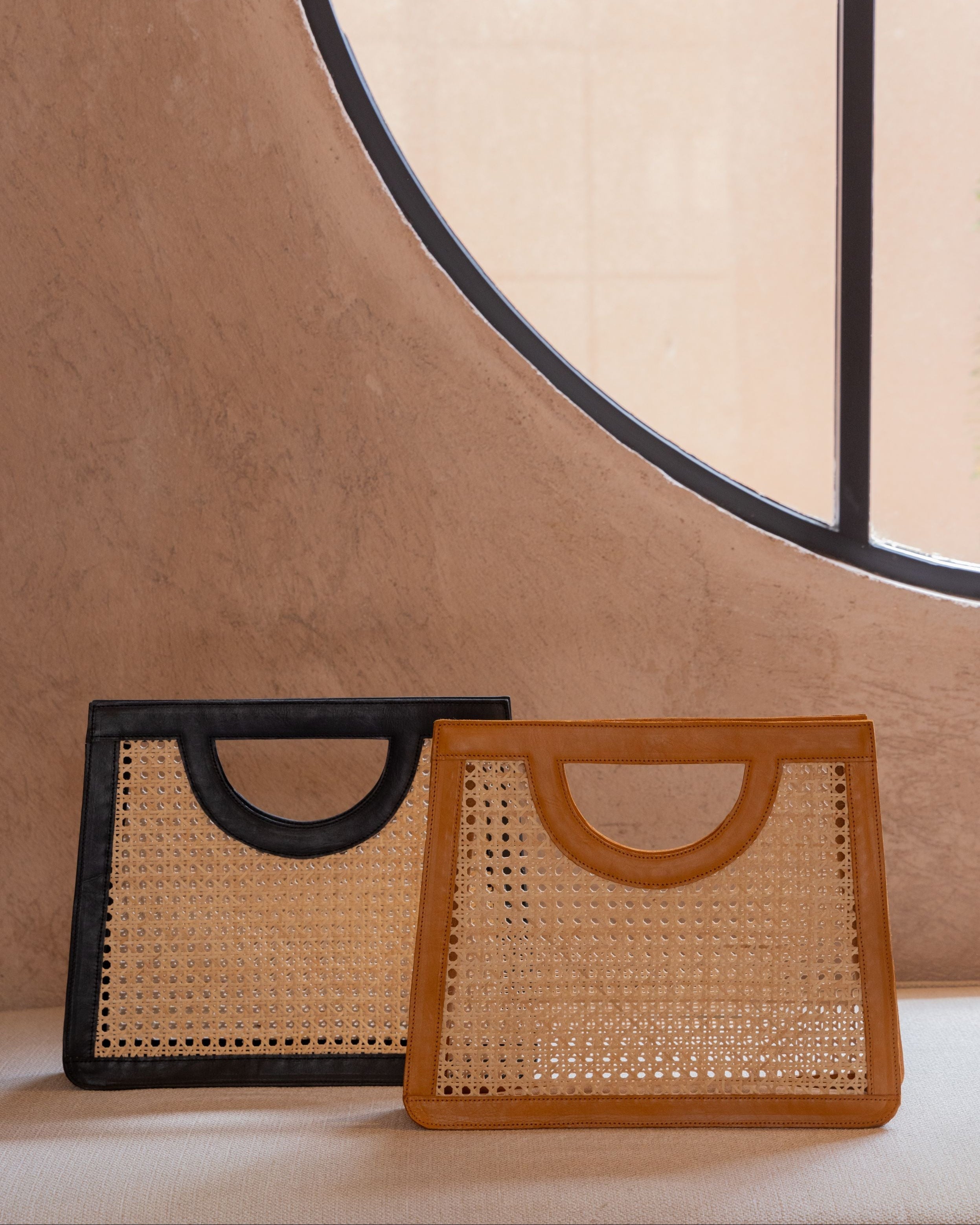 Cora Leather and Rattan Handbag handmade by Village Thrive using natural materials.