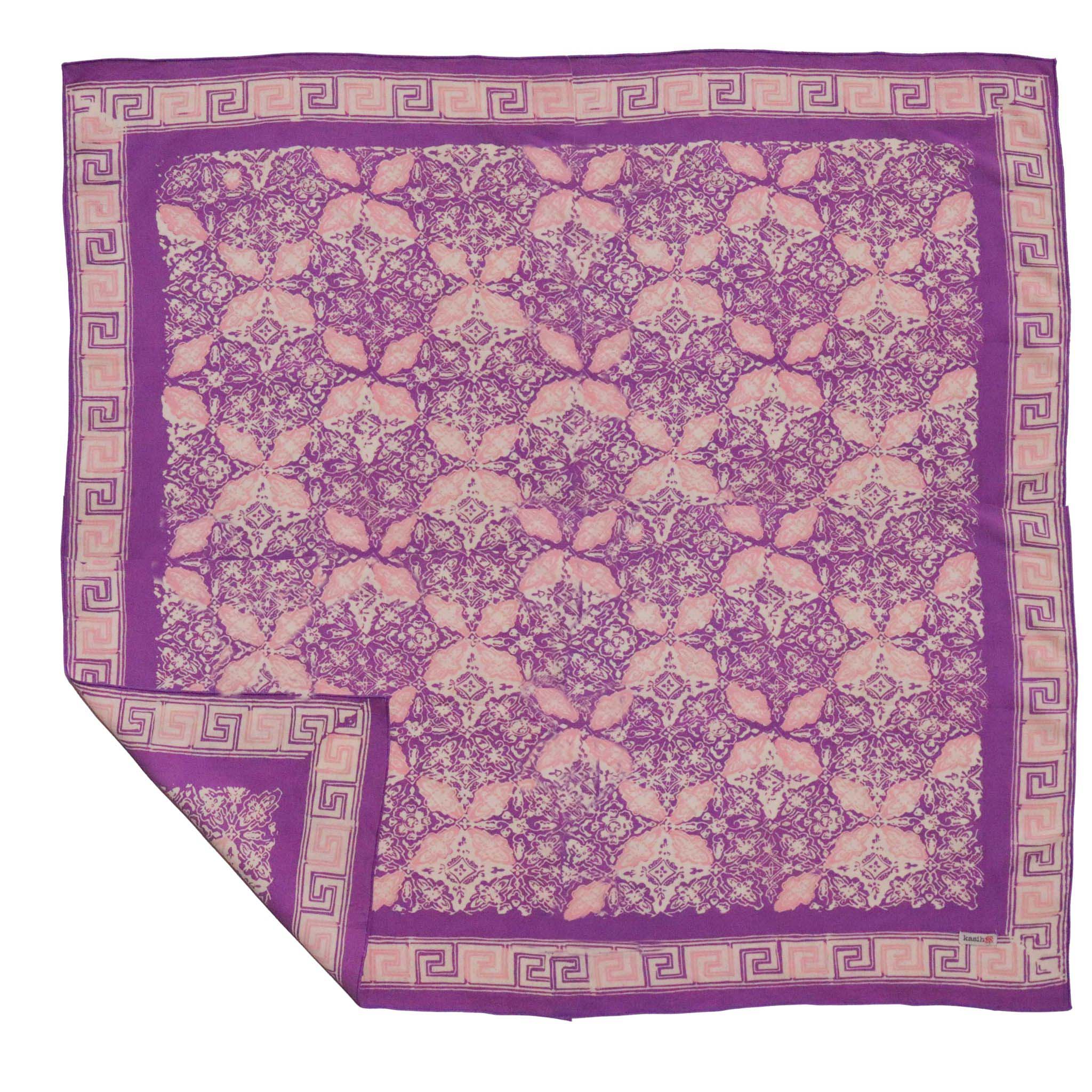 Purple and beige patterned bandana with a decorative border on a white background