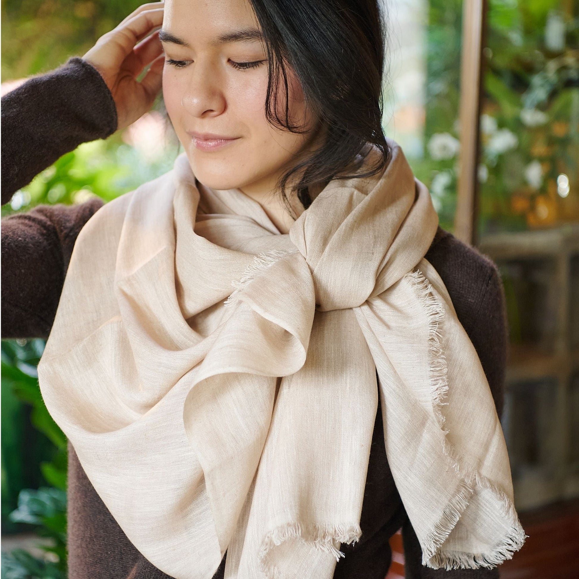 Oat Beige Neutral Hand Woven Soft Linen Silk Scarf styled elegantly on a model outdoors.