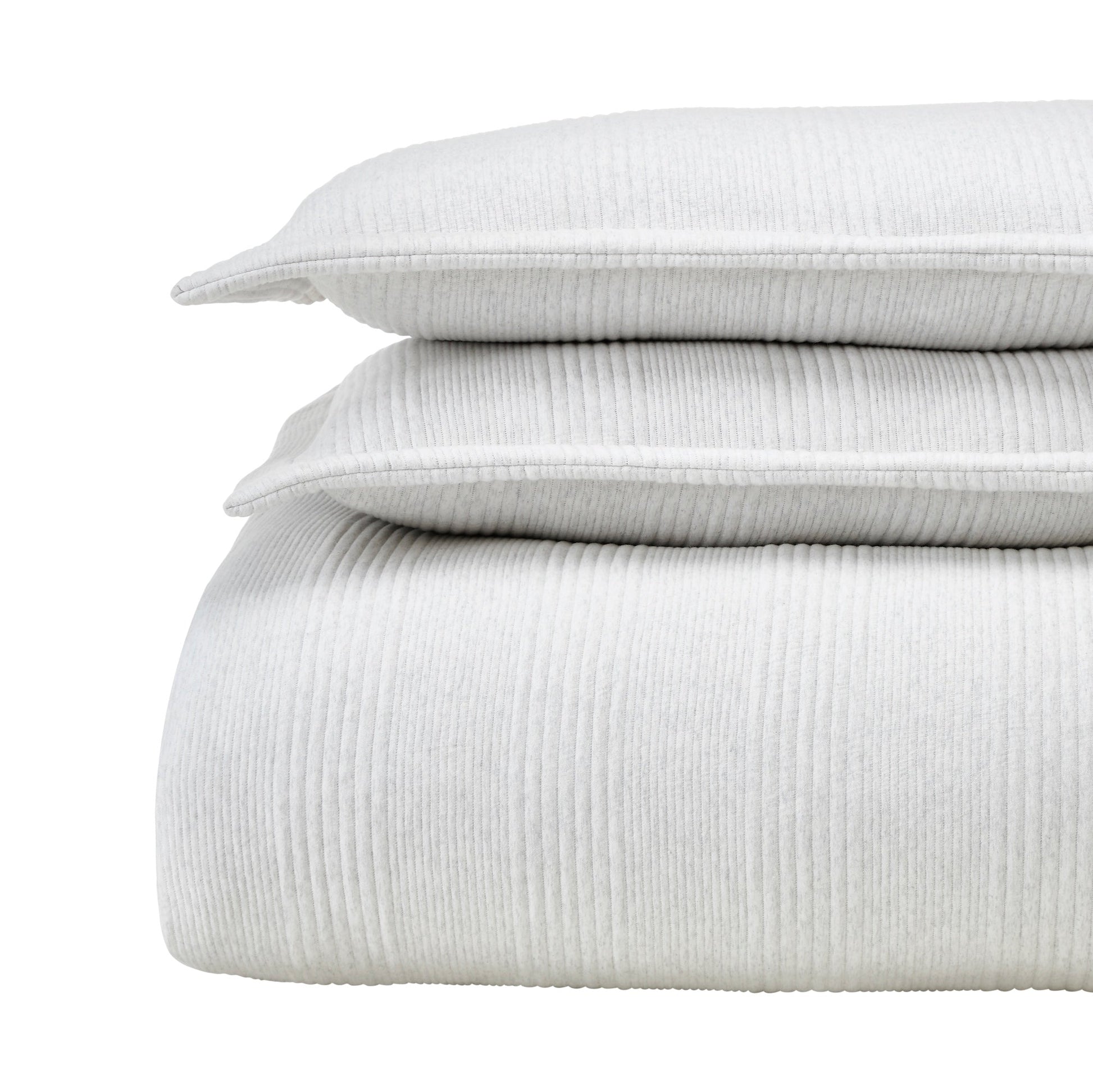 DT-043-9092_5|Stacked light grey ribbed duvet cover, two matching pillows, neatly folded, presenting soft, luxurious bedding.
