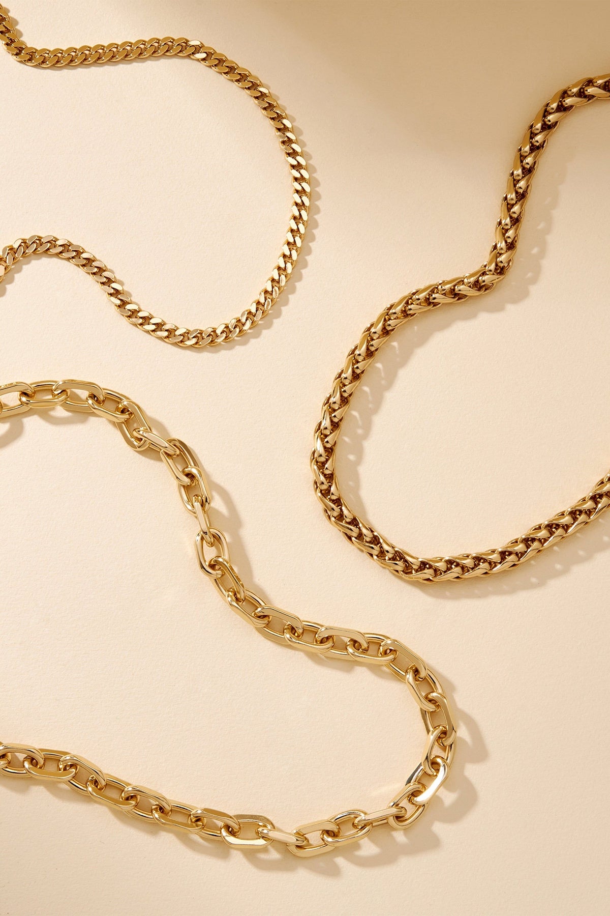 Gold chains from Lennon Necklace collection, sleek and stylish jewelry accessory