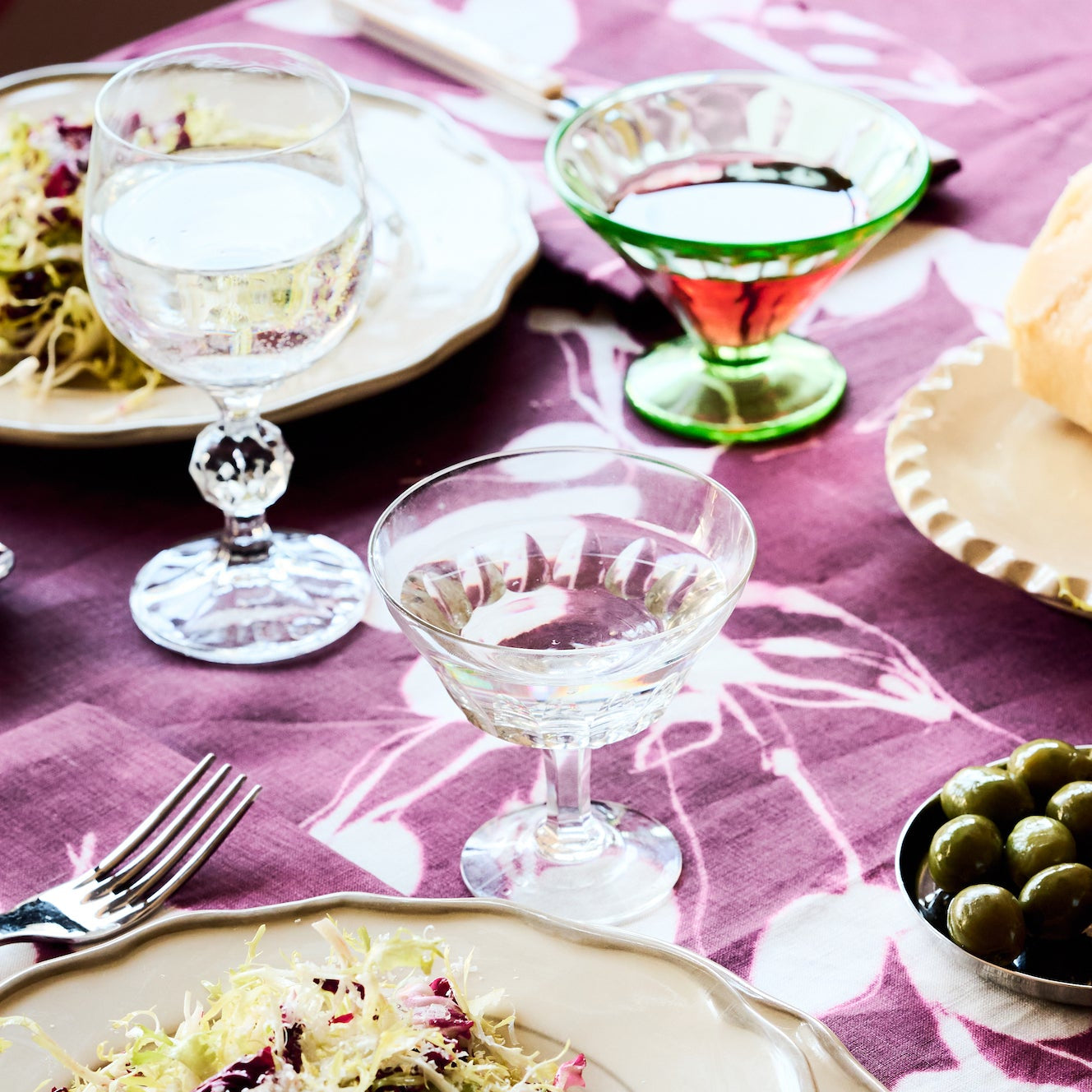 Porto Print Aubergine linen tablecloth close up of rich aubergine color and hand-painted floral detail - Goldie Home