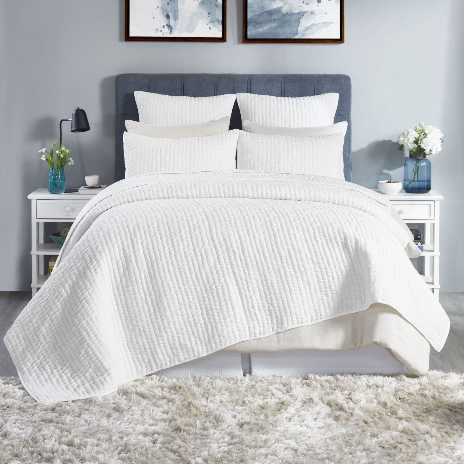 QT-358-9496_1|White quilted bedding set with subtle textured stripes, styled on a minimalist bed for a fresh and inviting bedroom aesthetic.