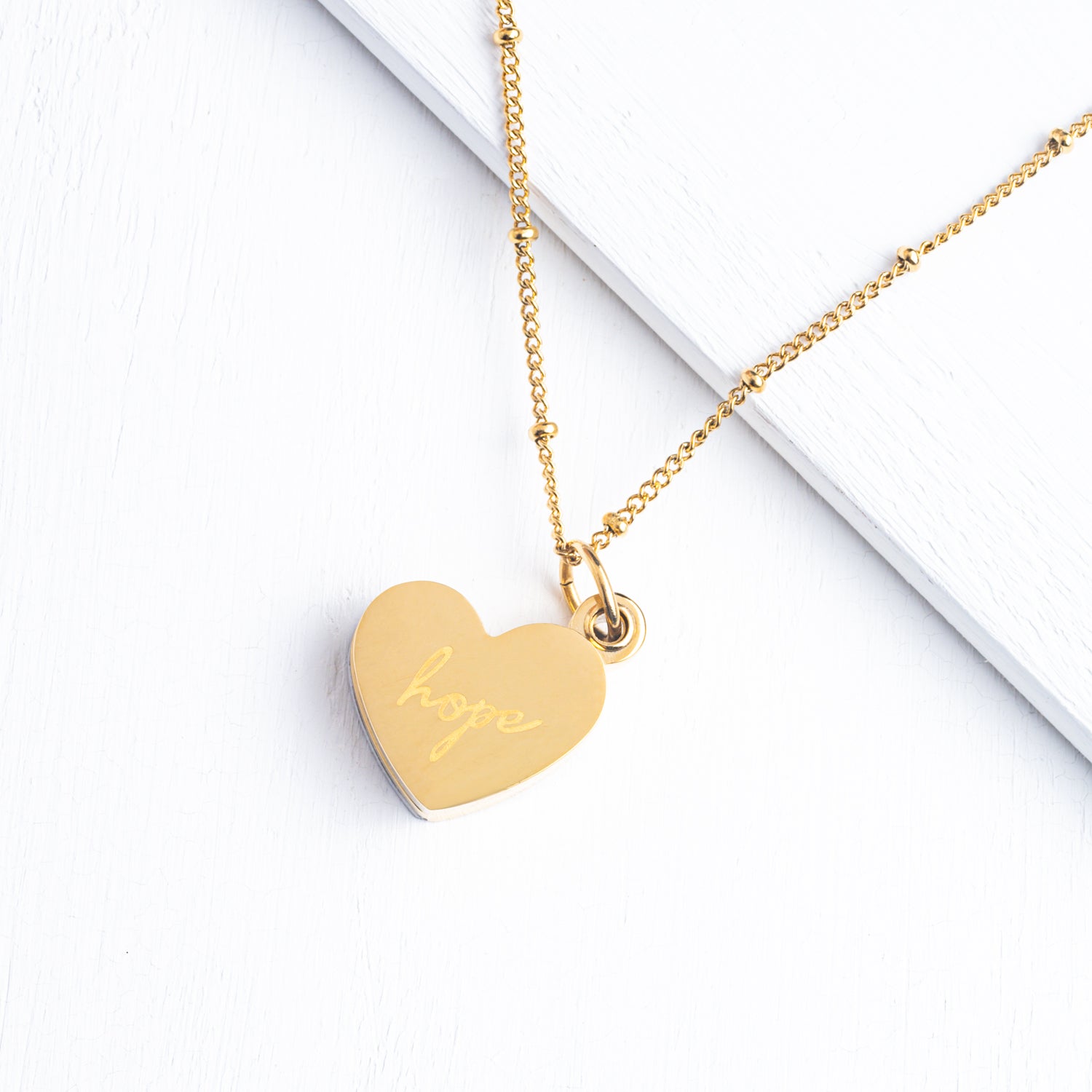 Engravable heart shaped locket, women's custom jewelry, custom gold necklace, fair trade jewelry business