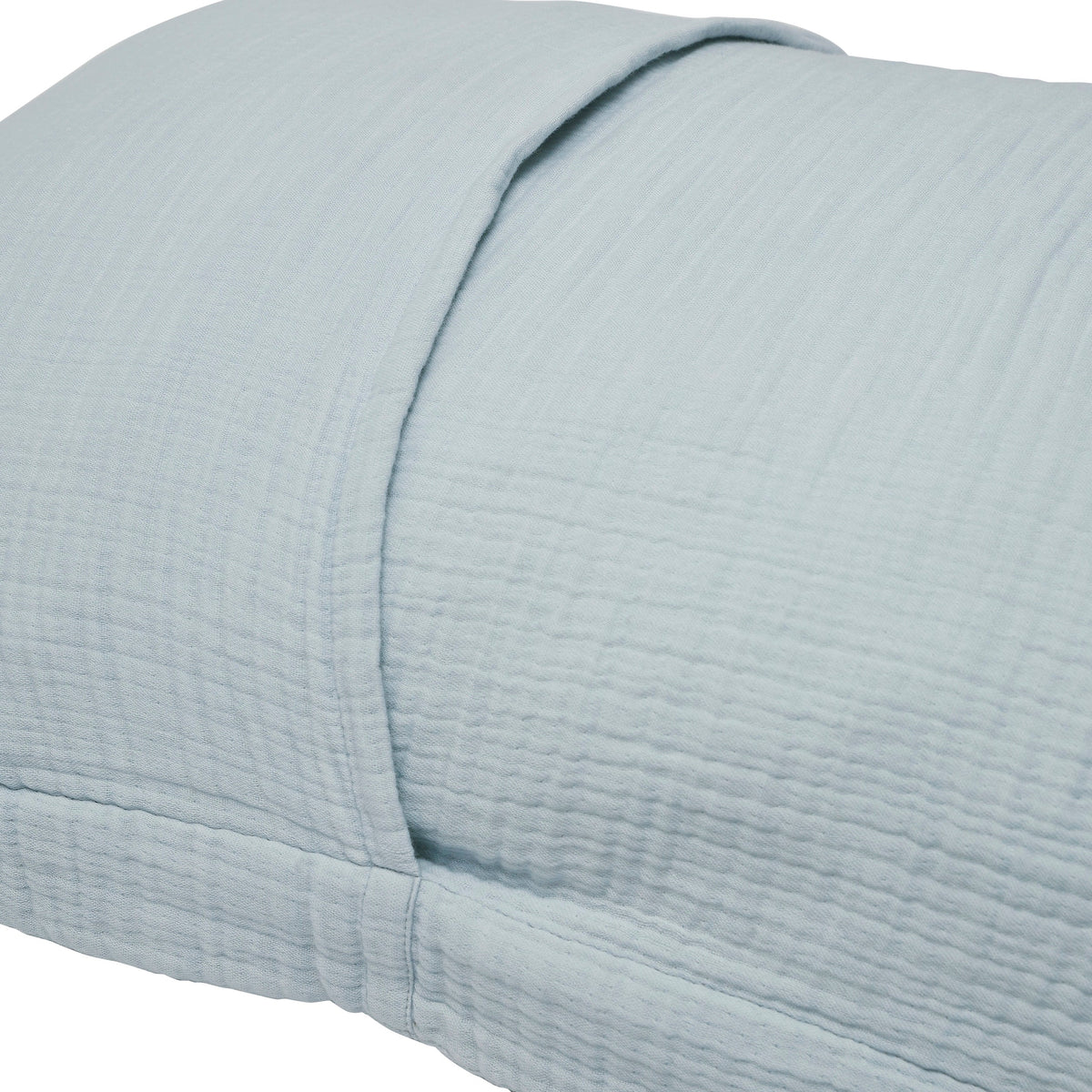 SS-050-2026_2|Close-up of a serene light blue organic cotton duvet cover with a soft, crinkled texture, highlighting its subtle folds.