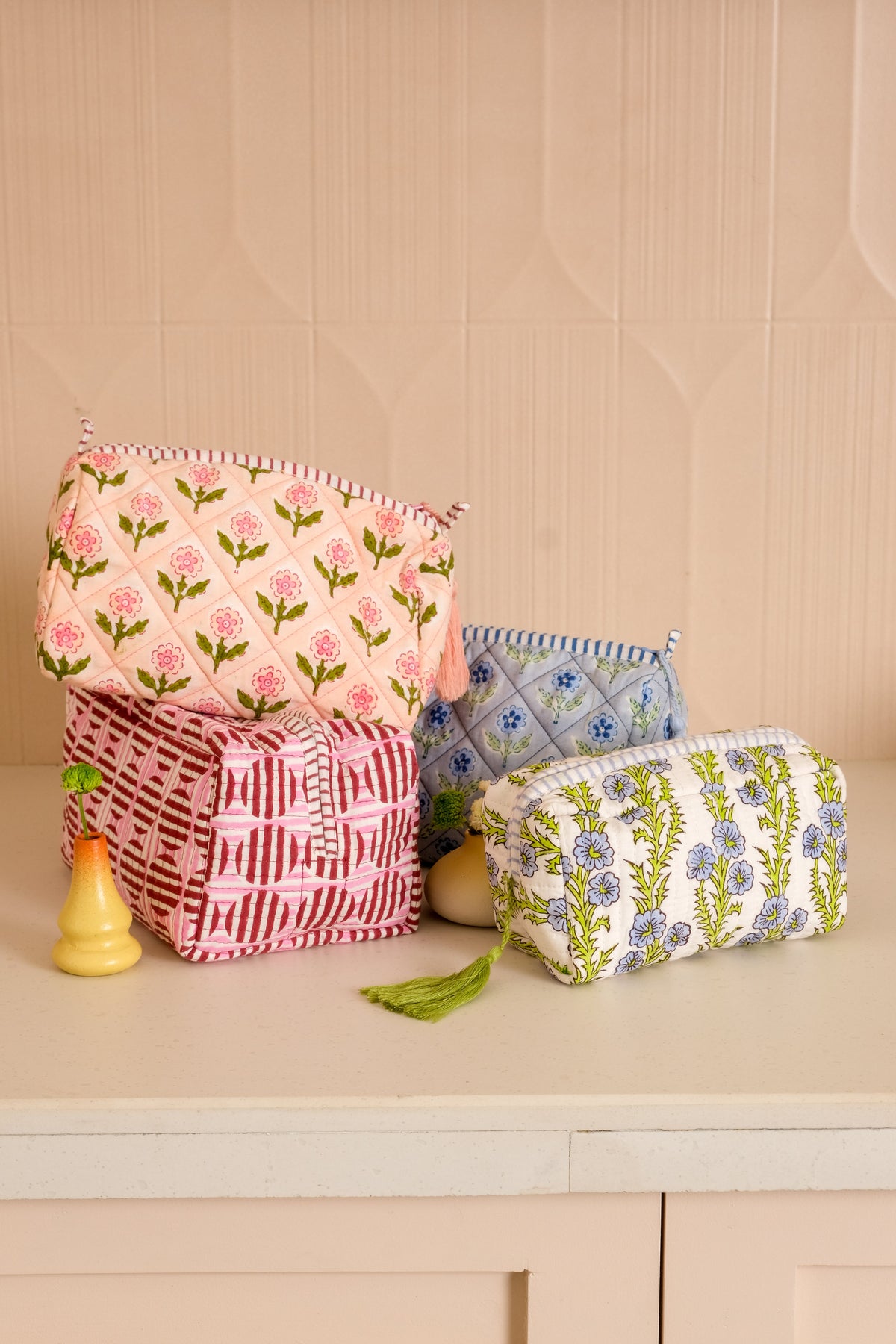 Inner Child burgundy pink striped circle blockprint makeup bag displayed with decor