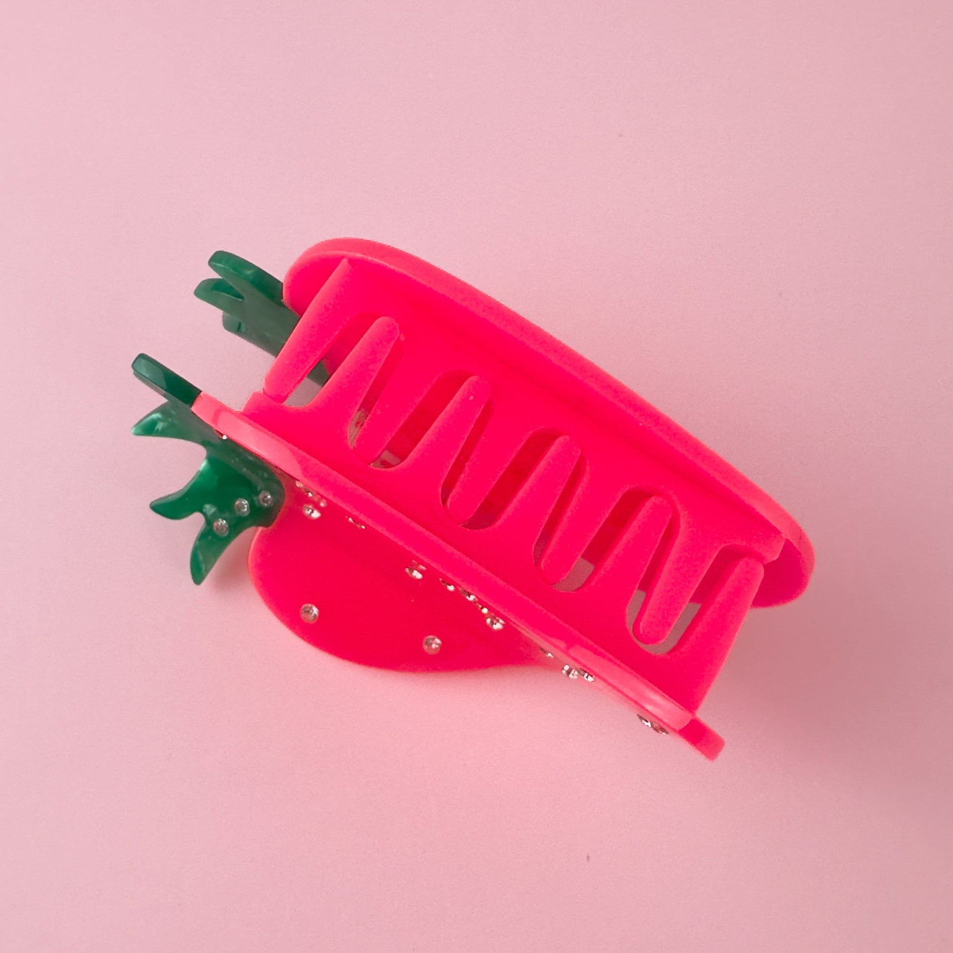 Neon strawberry hair claw in hot pink and green with crystals from Centinelle Handmade on cellulose acetate, with splice technique, exquisite miniature details and crystals, that are tied directly to its value and make them unique and special. 