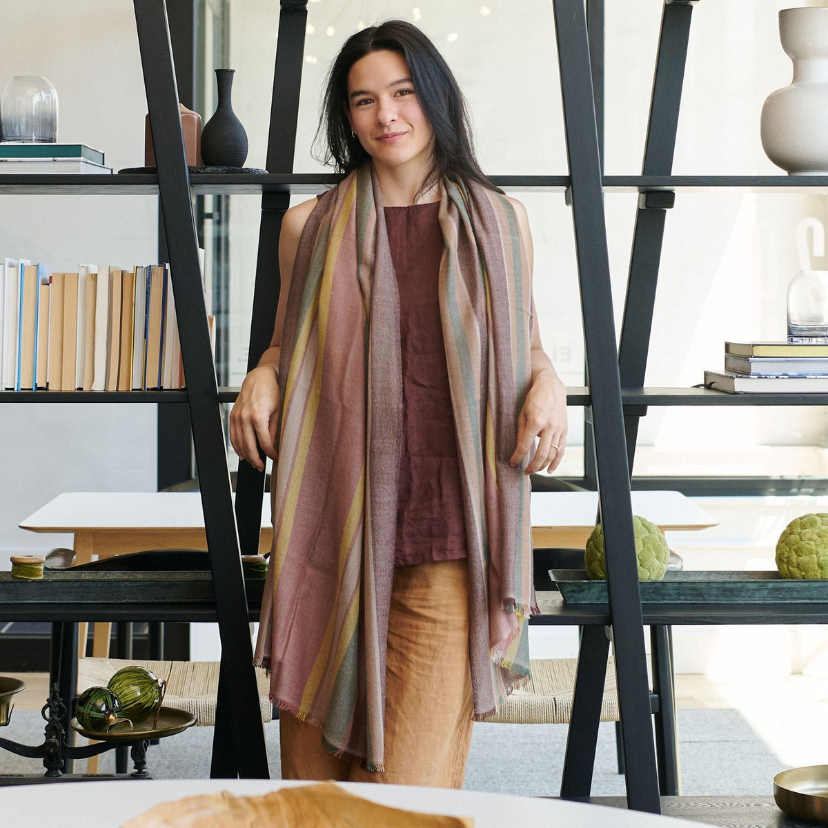 Barque Clay Modern Artisan Striped Soft Merino Handwoven Scarf worn by a model in a stylish indoor setting.