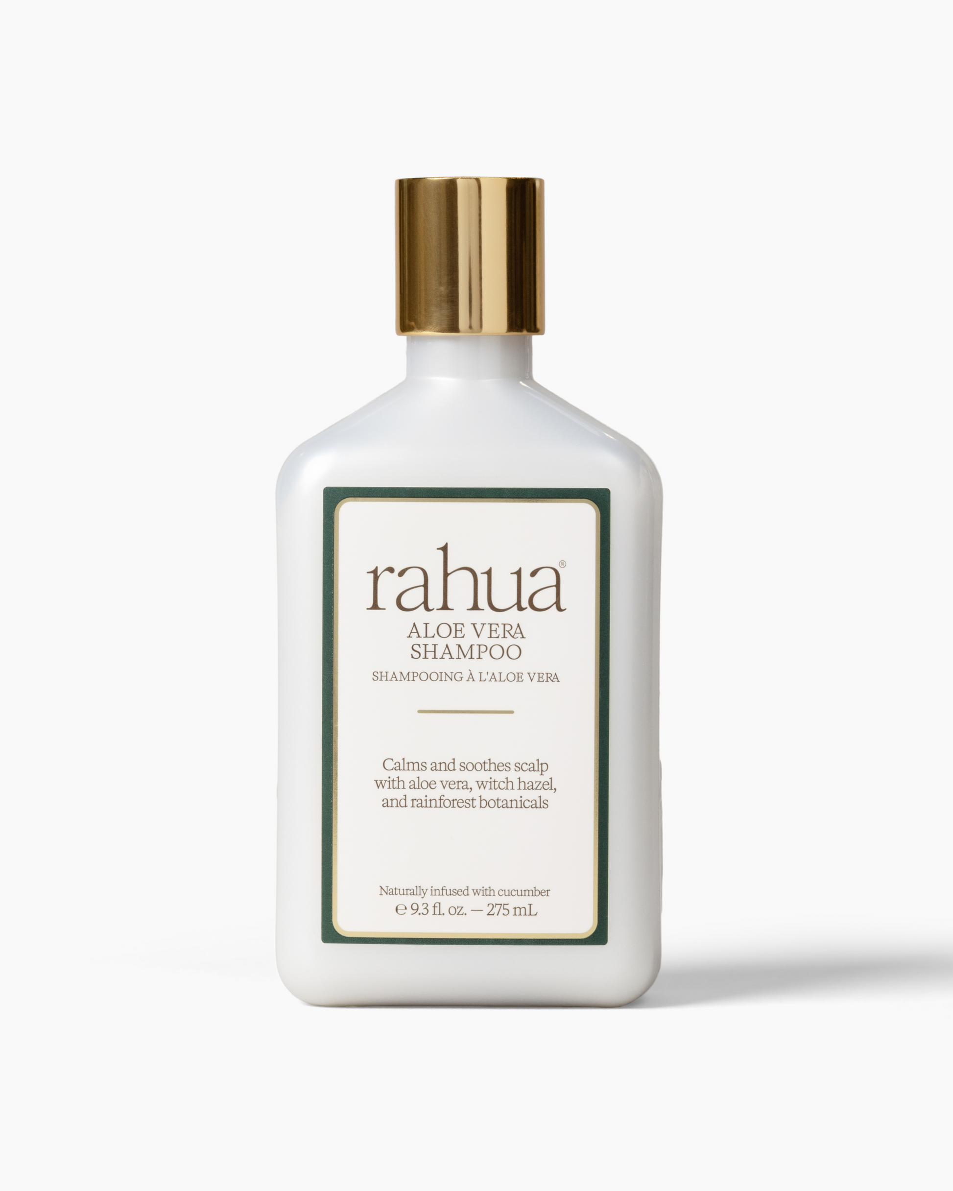 White shampoo bottle with gold cap and 'rahua' label on a white background