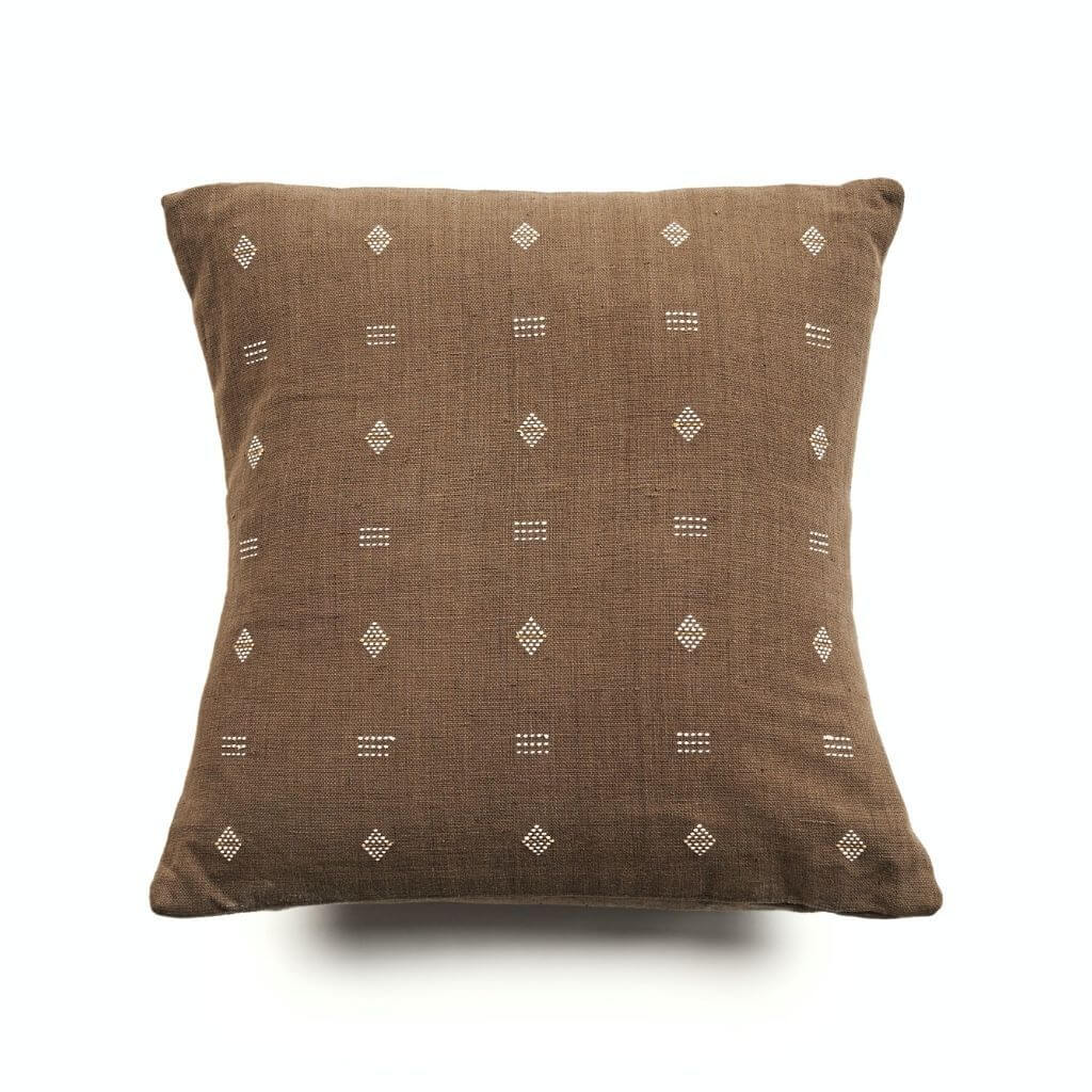 Nira Ochre Hand Spun Organic Cotton Handloom Pillow with classic pattern and undyed yarns on ochre background.