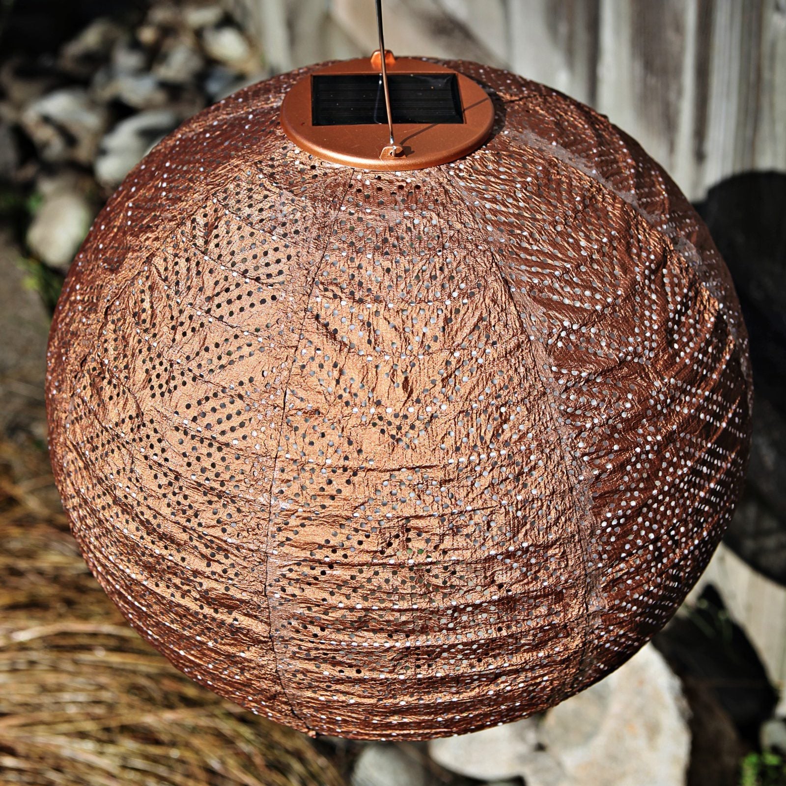 Soji Stella Market 12" Tyvek Solar Lantern in garden