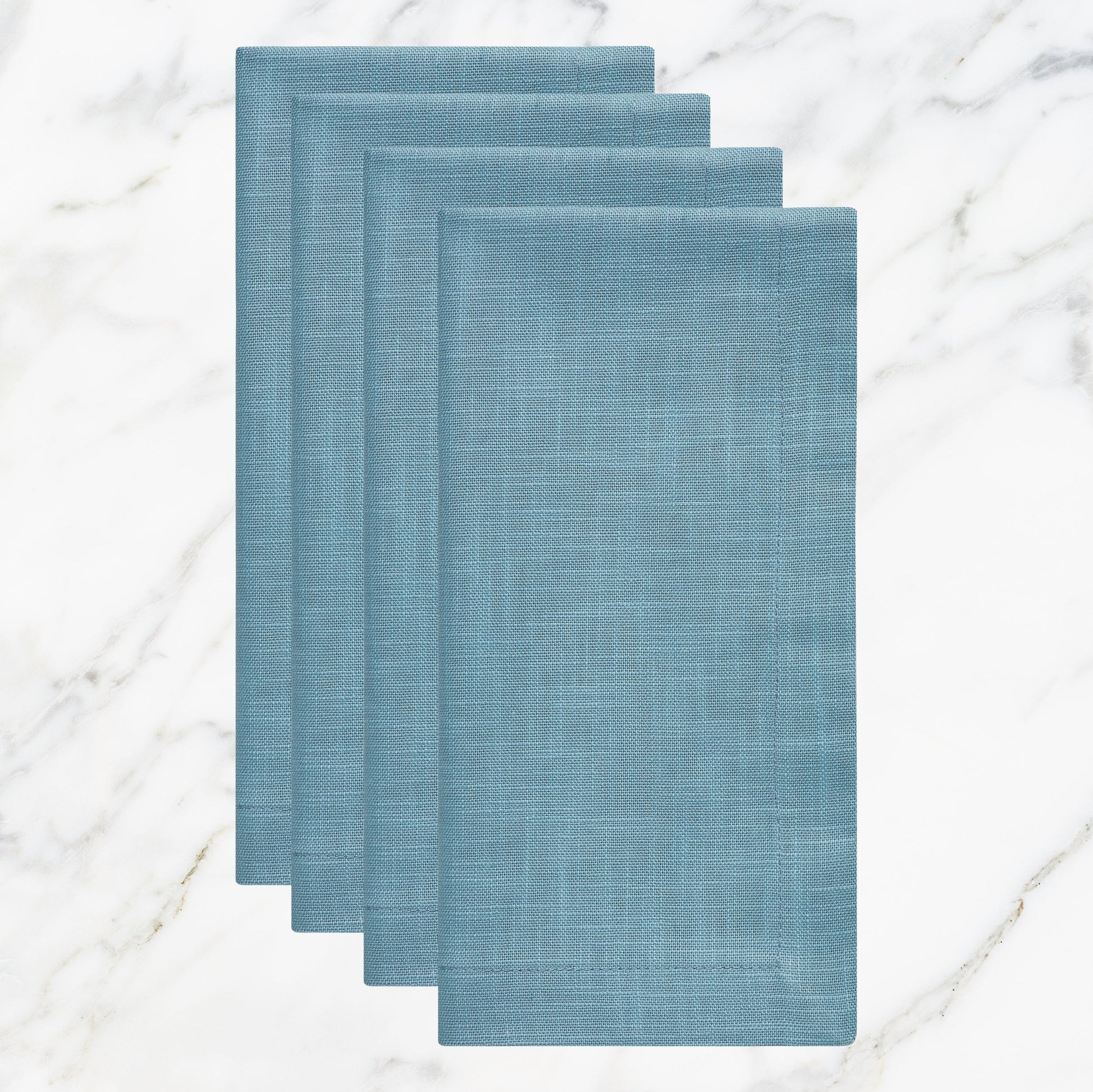 NP-4802-2020_1|Set of four folded light blue linen-feel cloth dinner napkins, durable and elegant for dining, parties, or everyday use.