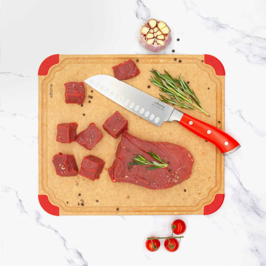 Raw steak and herbs on Elihome Premium Series Large Cutting Board with red non-slip corners