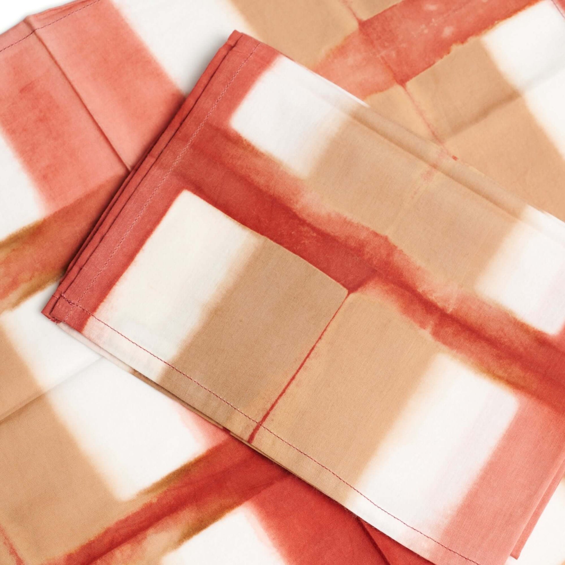 Chowk Red Print Cotton Artisanal Table Napkin Set featuring a vibrant red and beige design.