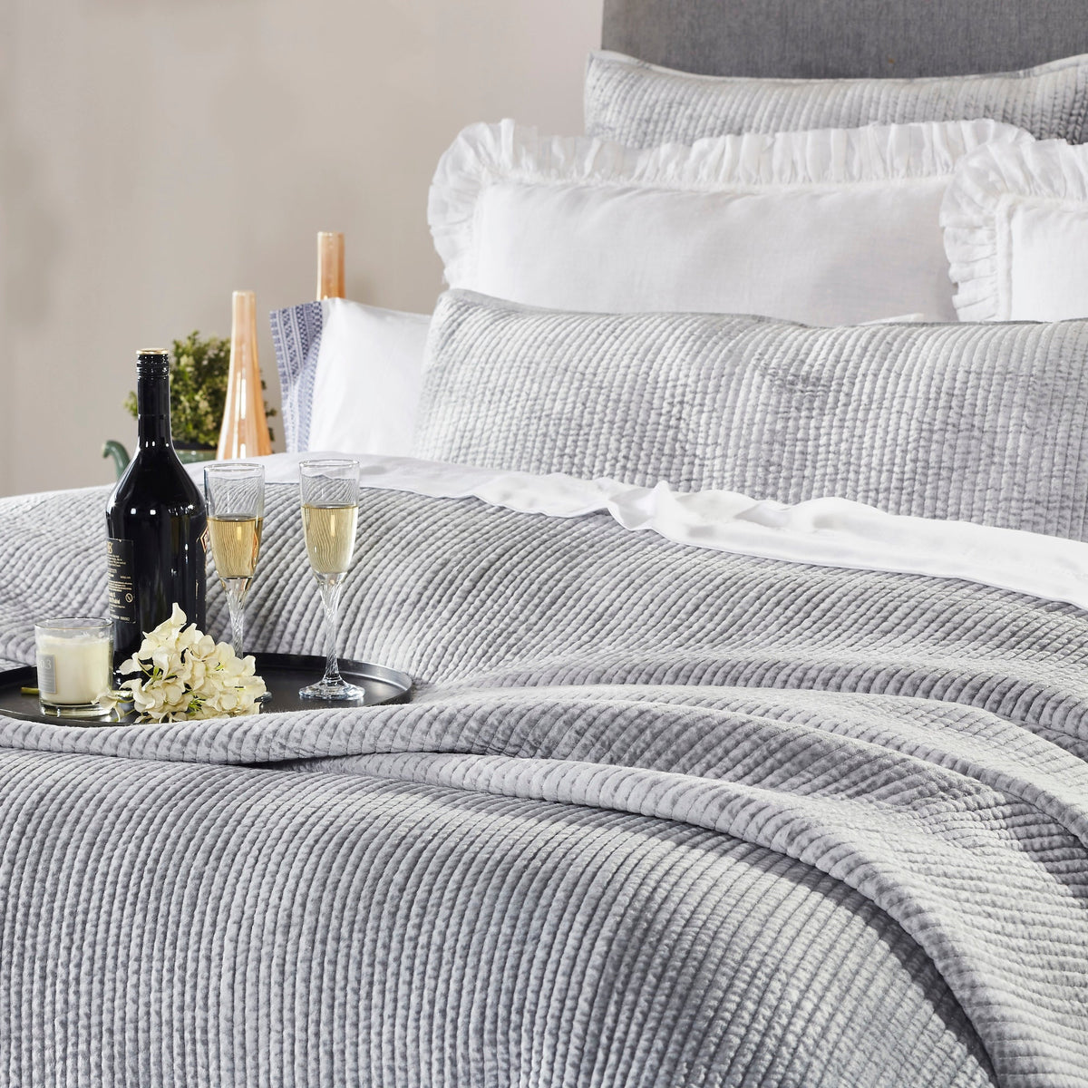 CL-157-11096_1|Pristine white textured coverlet drapes elegantly on a bed, providing a clean, luxurious, and inviting contemporary bedroom look.