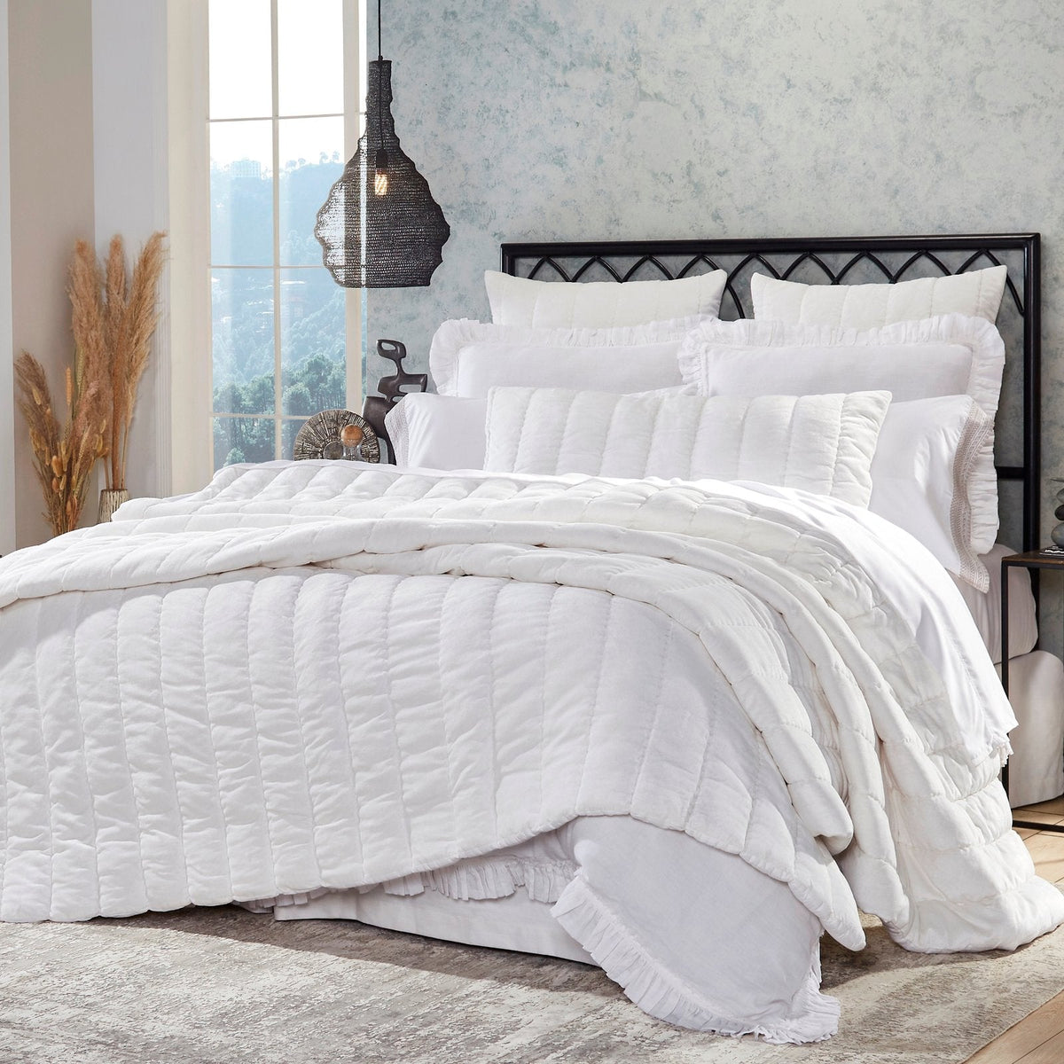 QT-337-9496_2|Crisp white textured quilt with sleek channel quilting on a beautifully styled bed. Modern and inviting bedroom decor.