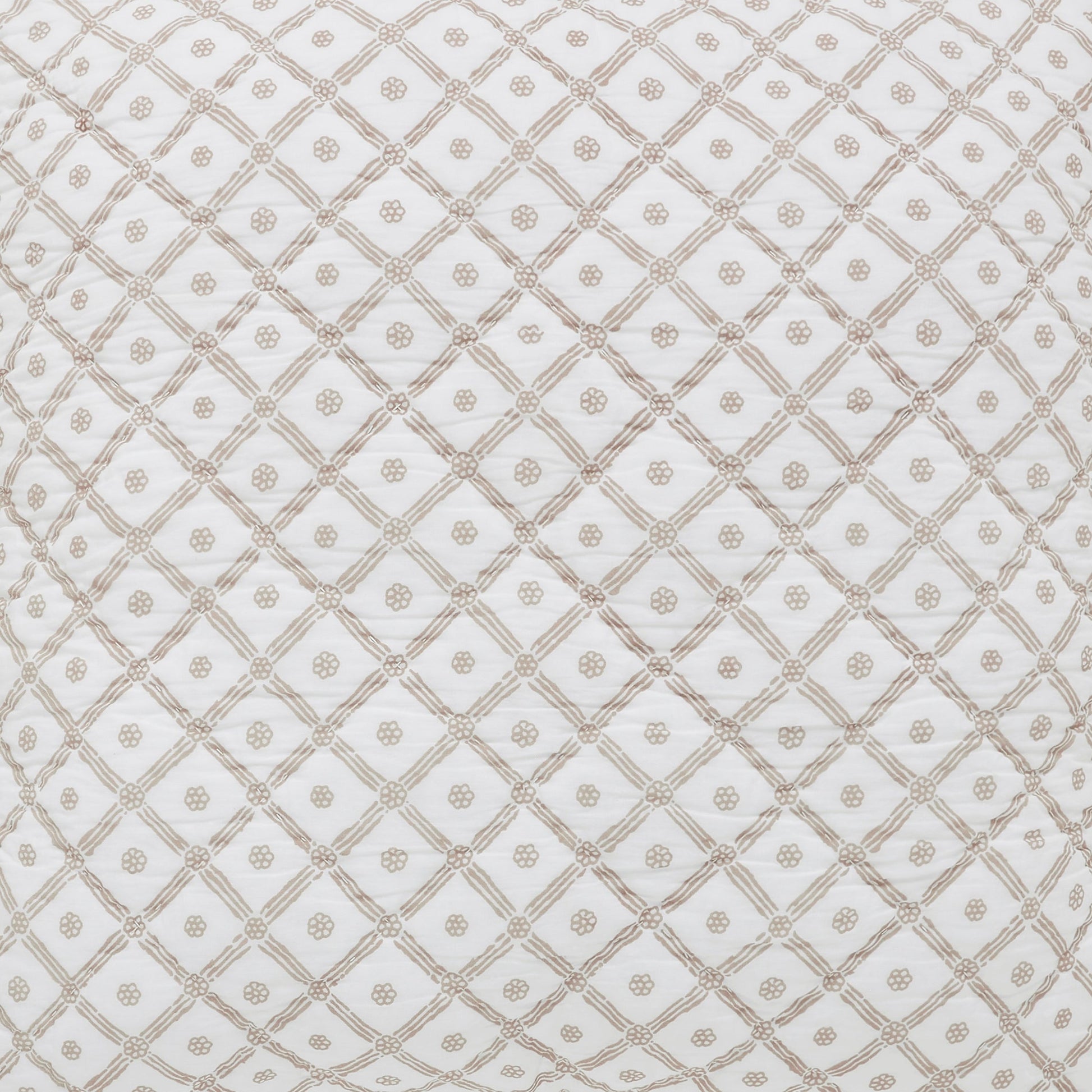 ES-346-2626_3|Close-up of white quilt fabric with light brown intricate floral crisscross pattern, detailed bedroom texture.