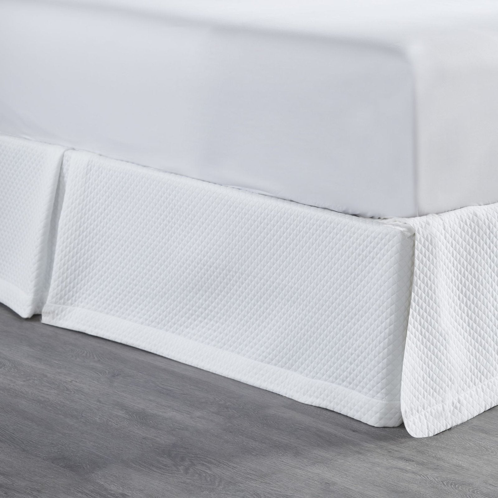 BS-117-6080_2|Close-up of white quilted panel bed skirt, highlighting the intricate diamond pattern and luxurious texture for bedrooms.