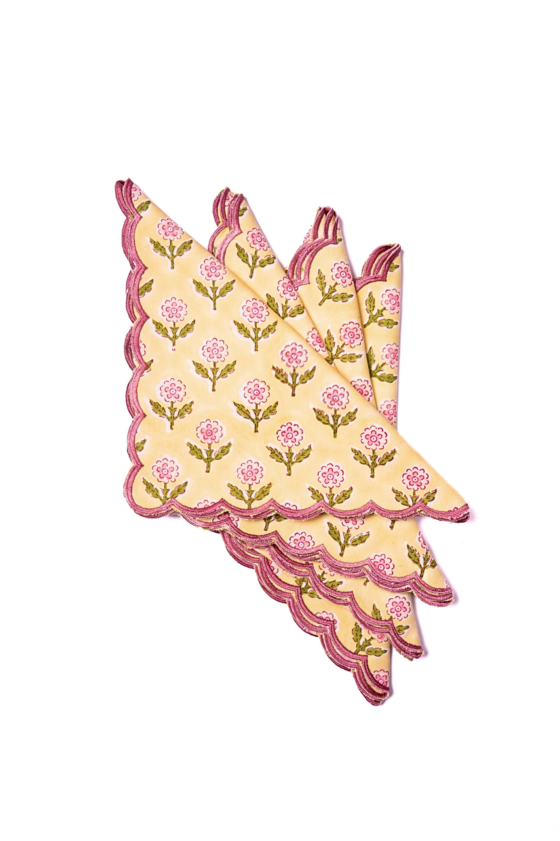 Inner Child stacked yellow scallop napkins with pink flowers set of 4