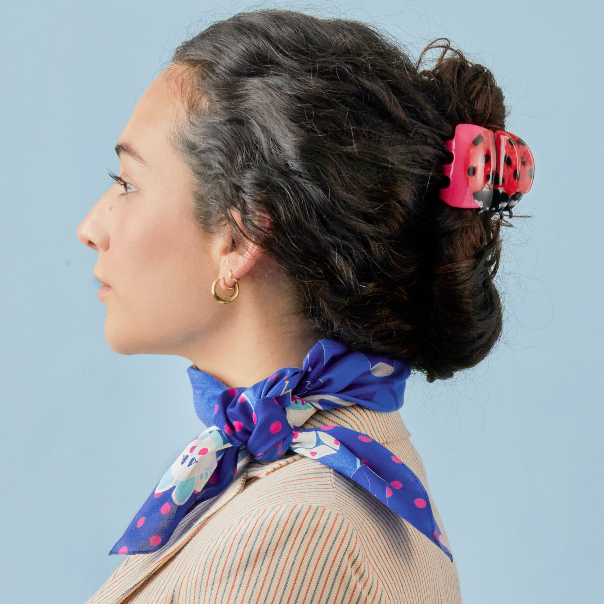 Fortune cotton silk bandana on blue, with white and hot pink touches, is full of lucky charms, maneki cat, tarot card, black cat, crossing fingers, dice and more, can be worn as a head scarf , neckerchief or to decorate your tote bag.  Made of a luxurious cotton-silk blend with a precise machine-stitched hemming, perfect as head wraps or neckerchiefs, bandana hairstyles, bandana headband; bandana style is in and now. Ethically sourced.