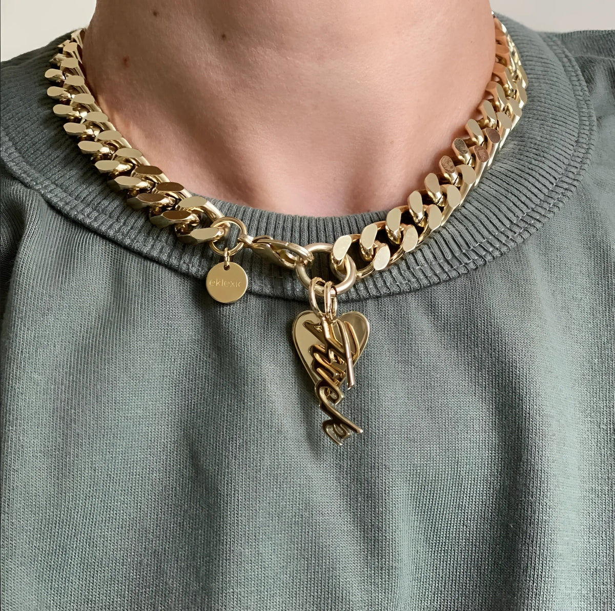 Gold chain necklace with heart and fun charms from Taraji Necklace collection