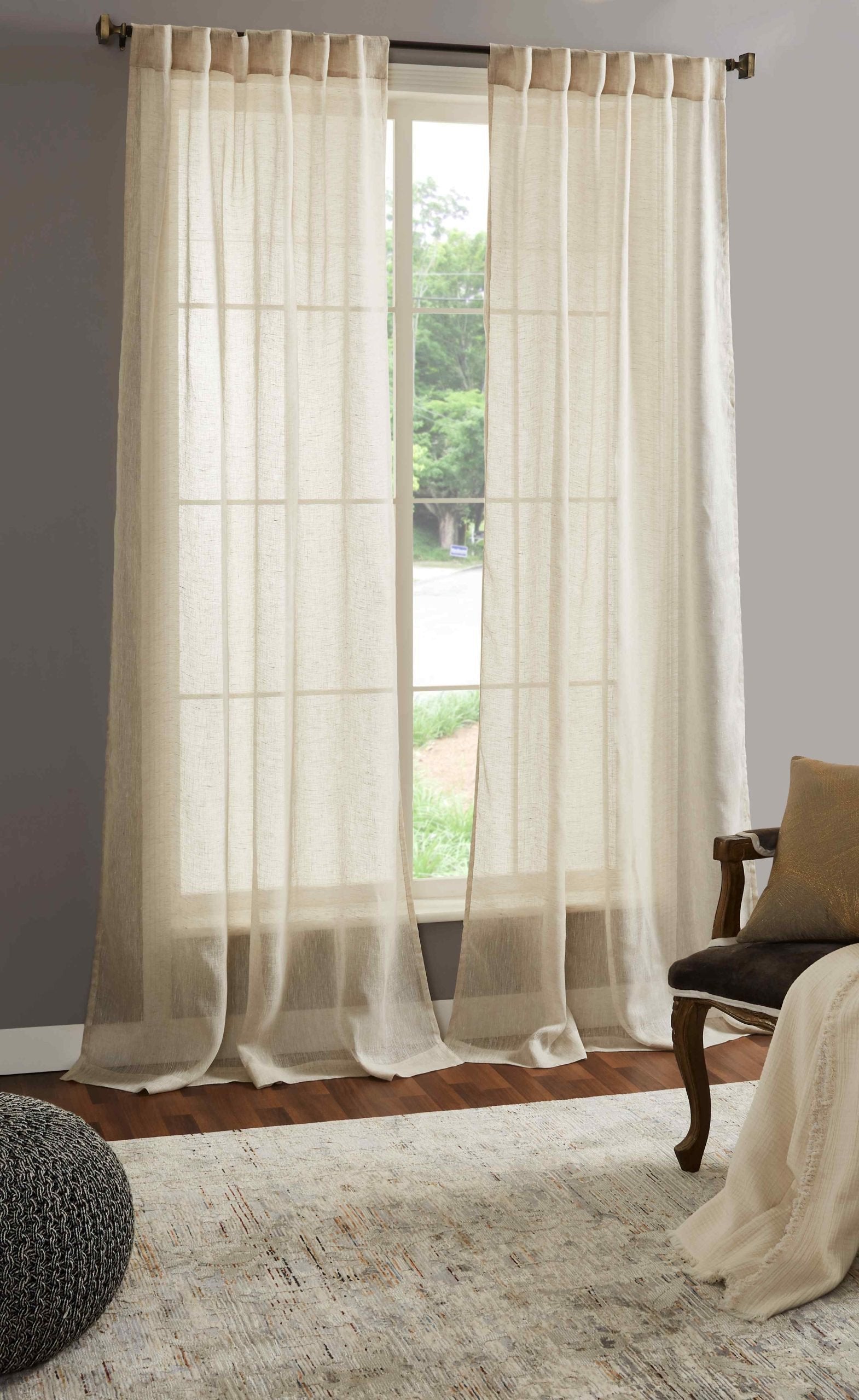 DY-709-5096_3|Pair of flowing natural beige linen tab top curtains, providing soft light and enhancing a relaxed, airy decor.