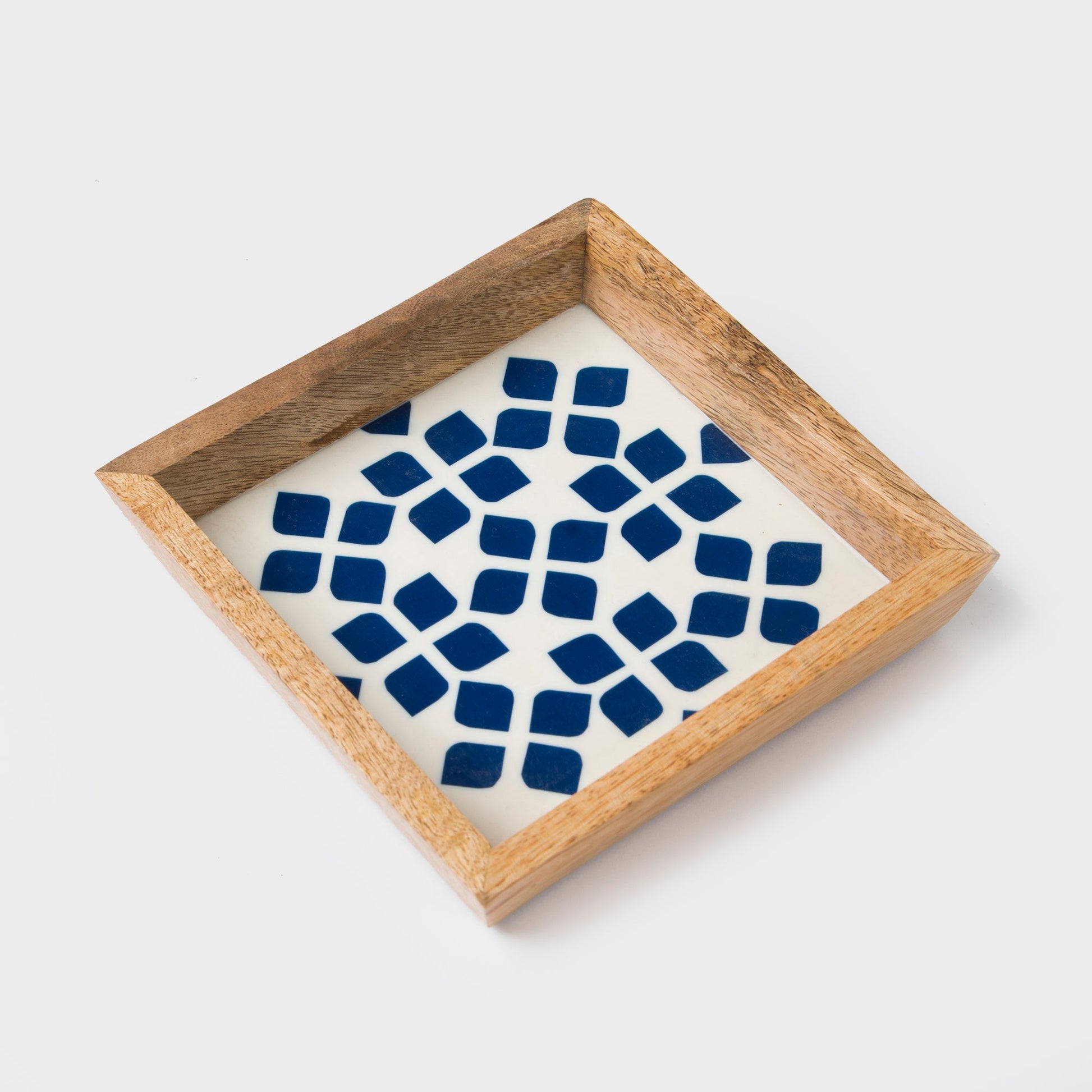Decorative tray with blue geometric pattern and wooden frame on a white background