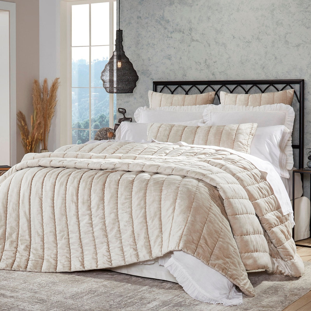 QT-339-11096_2|Stylish light beige velvet quilt featuring channel quilting, elegantly draped on a bed for a warm, inviting feel.