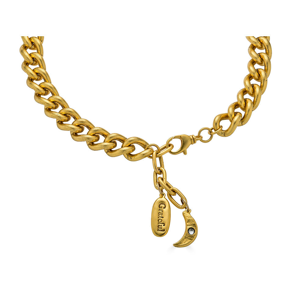 Back view of Grateful Heart Necklace with crescent moon charm and engraved "grateful" tag on clasp.
