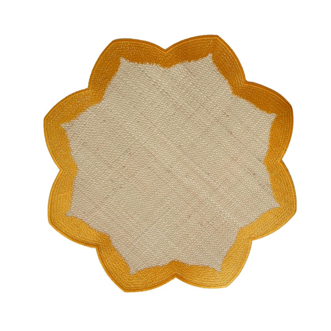 Buriti Petal placemat with flower-inspired silhouette handwoven from palm fiber in yellow by Talah Home