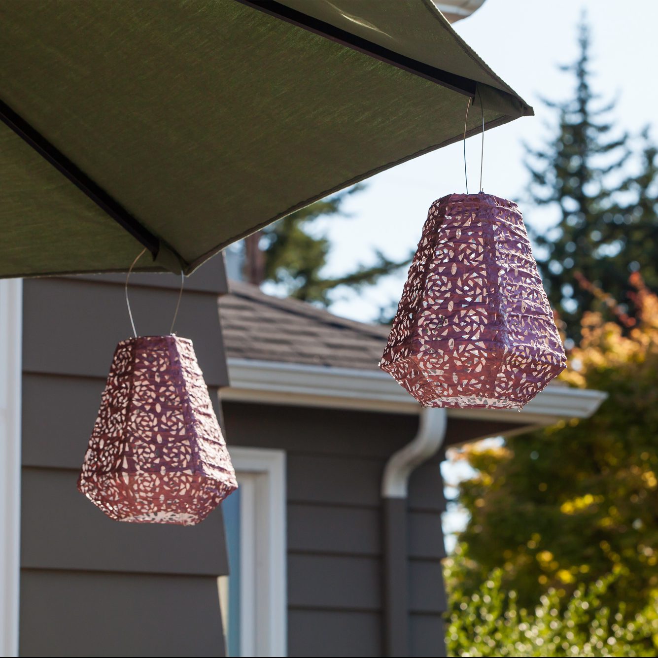 Soji Stella Prism Tyvek Solar Lantern under umbrella