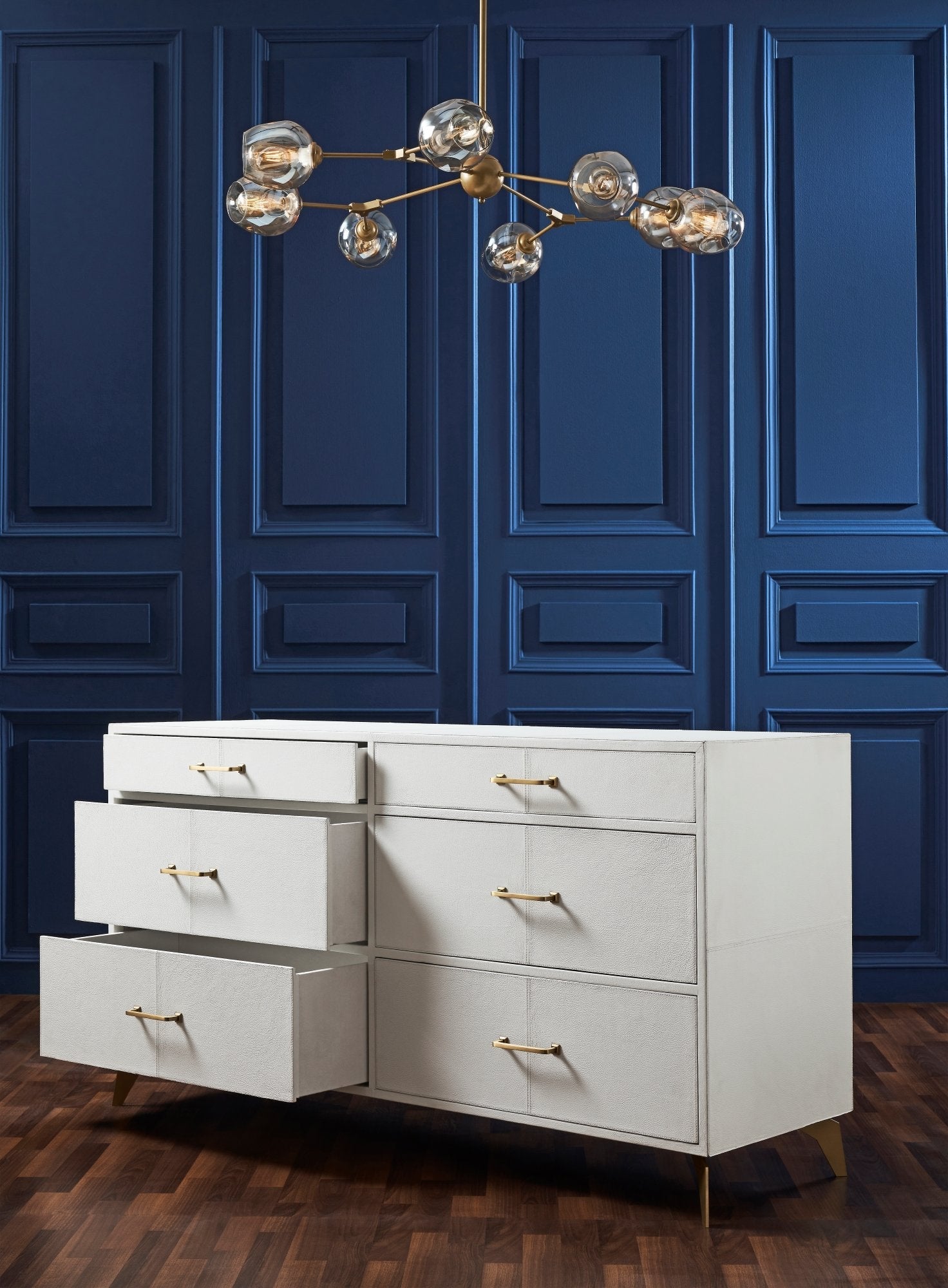 FN-5201-642033_3|Functional white genuine leather dresser with open drawers, revealing ample storage and elegant gold bar pull hardware.