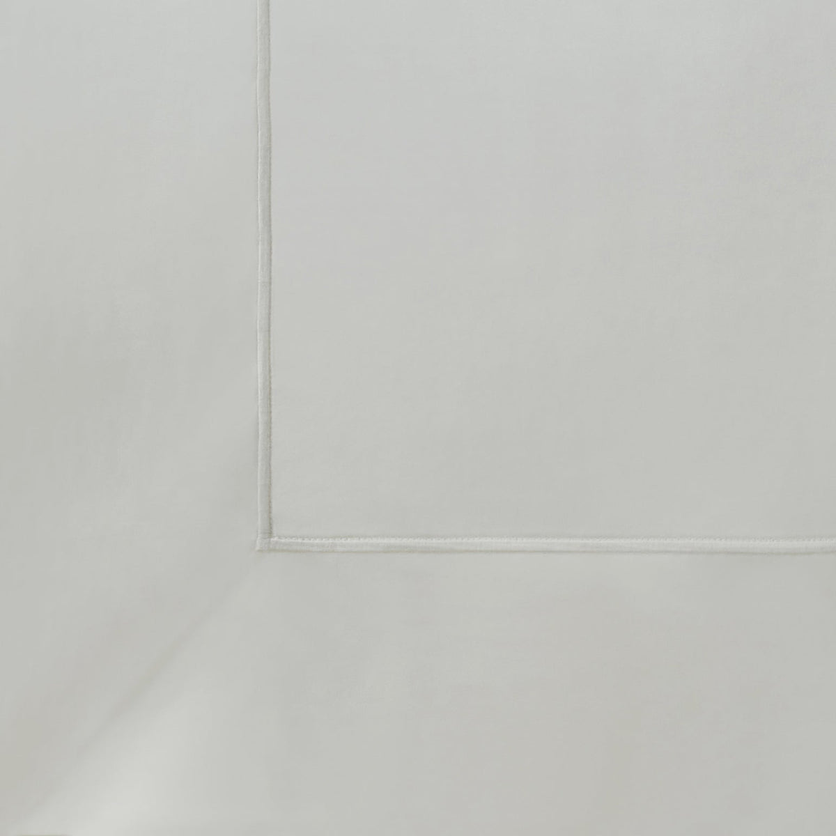 QFL-545-6080_8|Detailed close-up of soft off-white 100% cotton sheet with a simple hemline, showcasing quality fabric and finish.