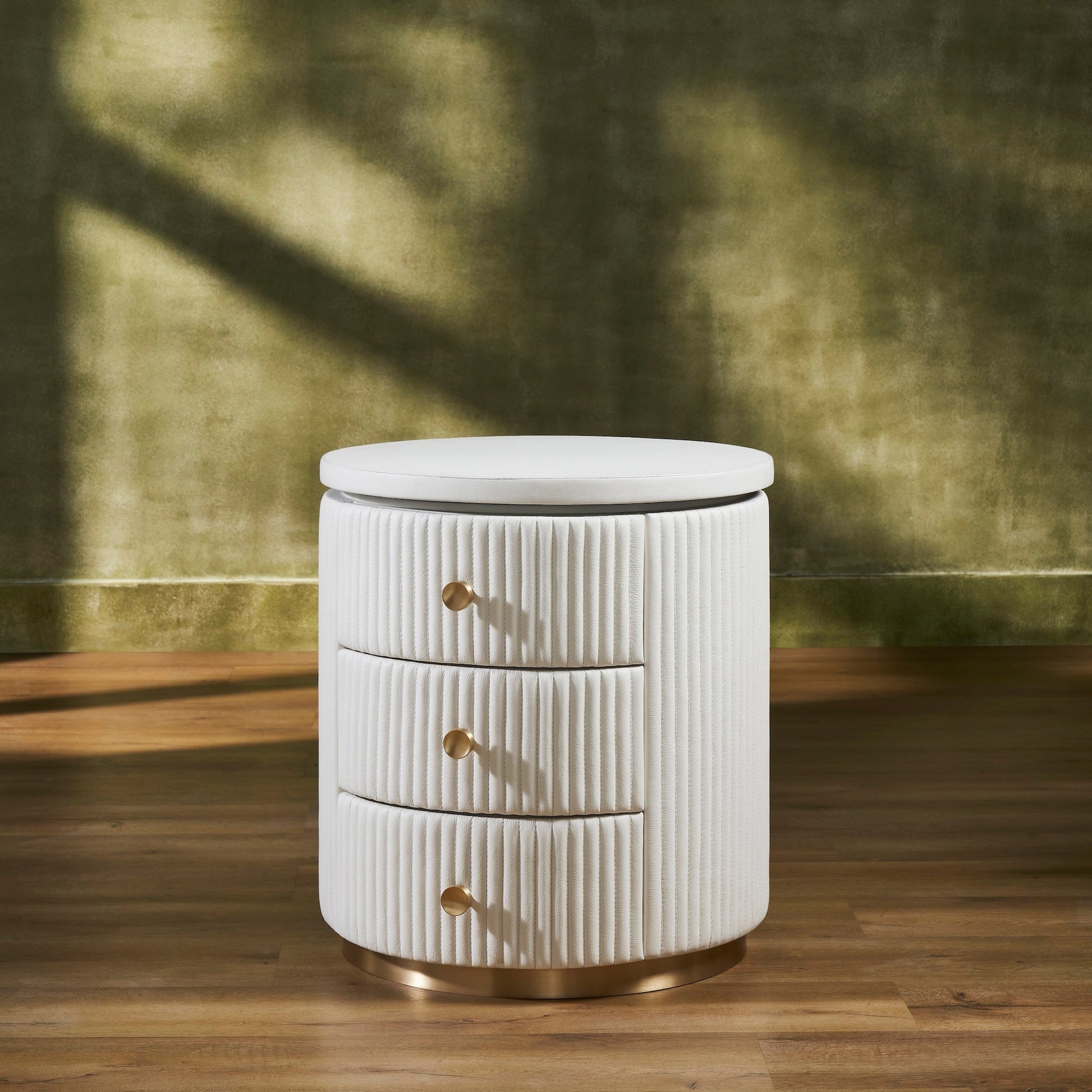 FN-5212-202022_2|Elegant white fluted leather round nightstand with three brass pull drawers, perfect luxury leather bedroom furniture.
